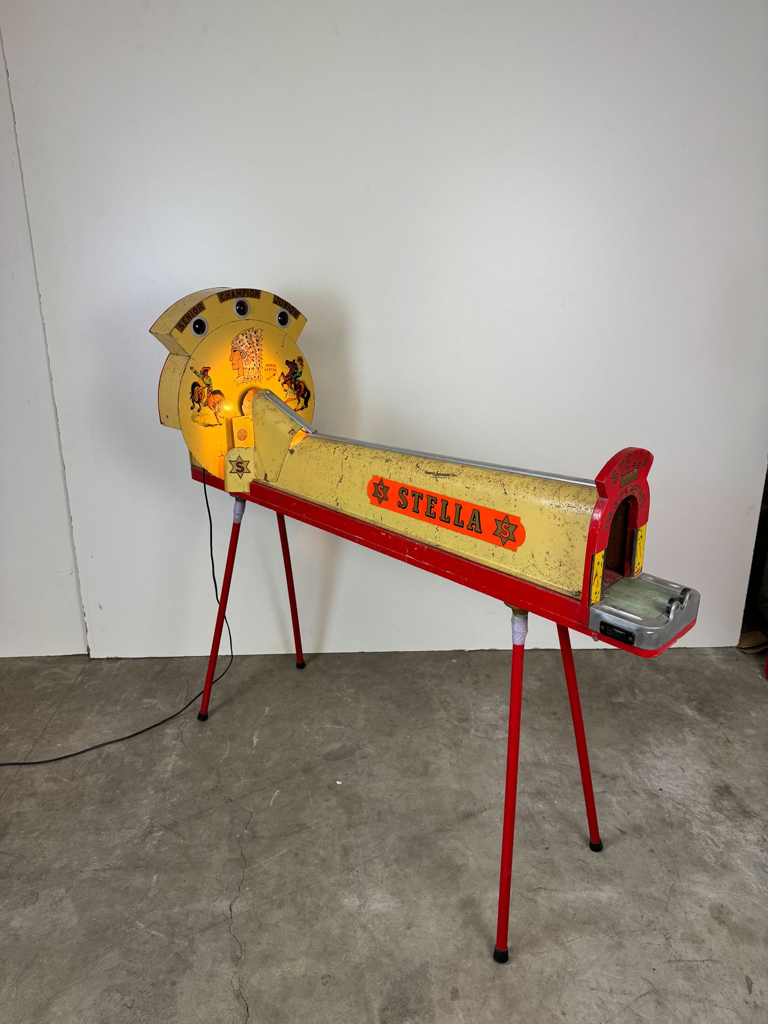 French Stella 25 m Precision Shooting Arcade Game Machine ca. 1950s: French Stella 25 m Precision Shooting Arcade Game Machine ca. 1950s. In a working condition, but doesn't come with an air gun. Dimensions (H x W x D): 116 x 40 x 135 cm. Condition: Good. Location: The