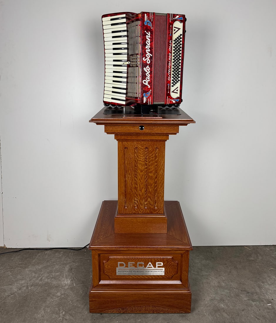 Decap Accordion Pedestal Self-playing MIDI Accordion: Decap Accordion Pedestal self-playing MIDI accordion in a very good working condition. With a revolutionary pressure control system and electronically controlled keys, this accordion masterfully repro