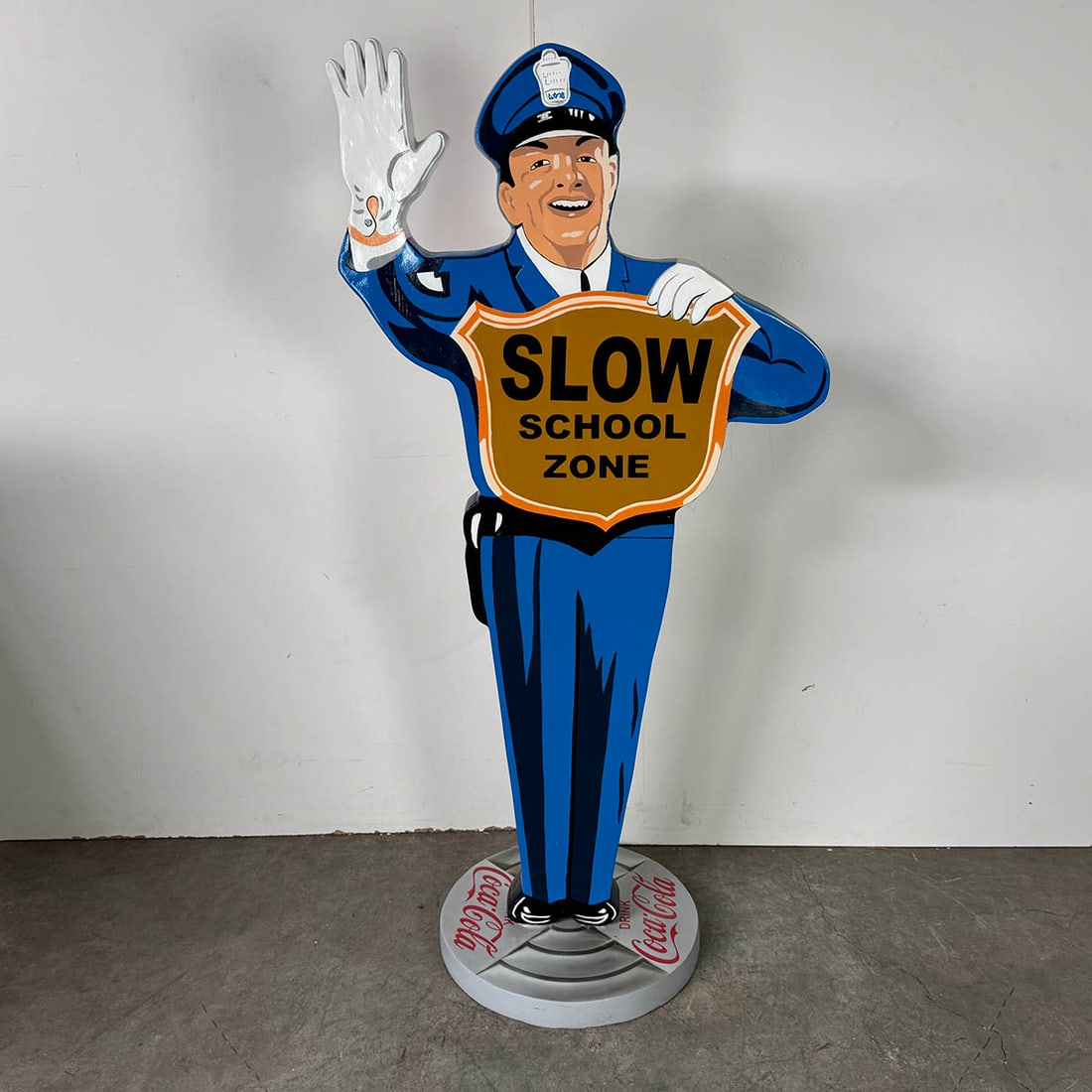 Resin Policeman Statue with Slow School Zone Sign and Coca-Cola Advertisements (1 of 10)