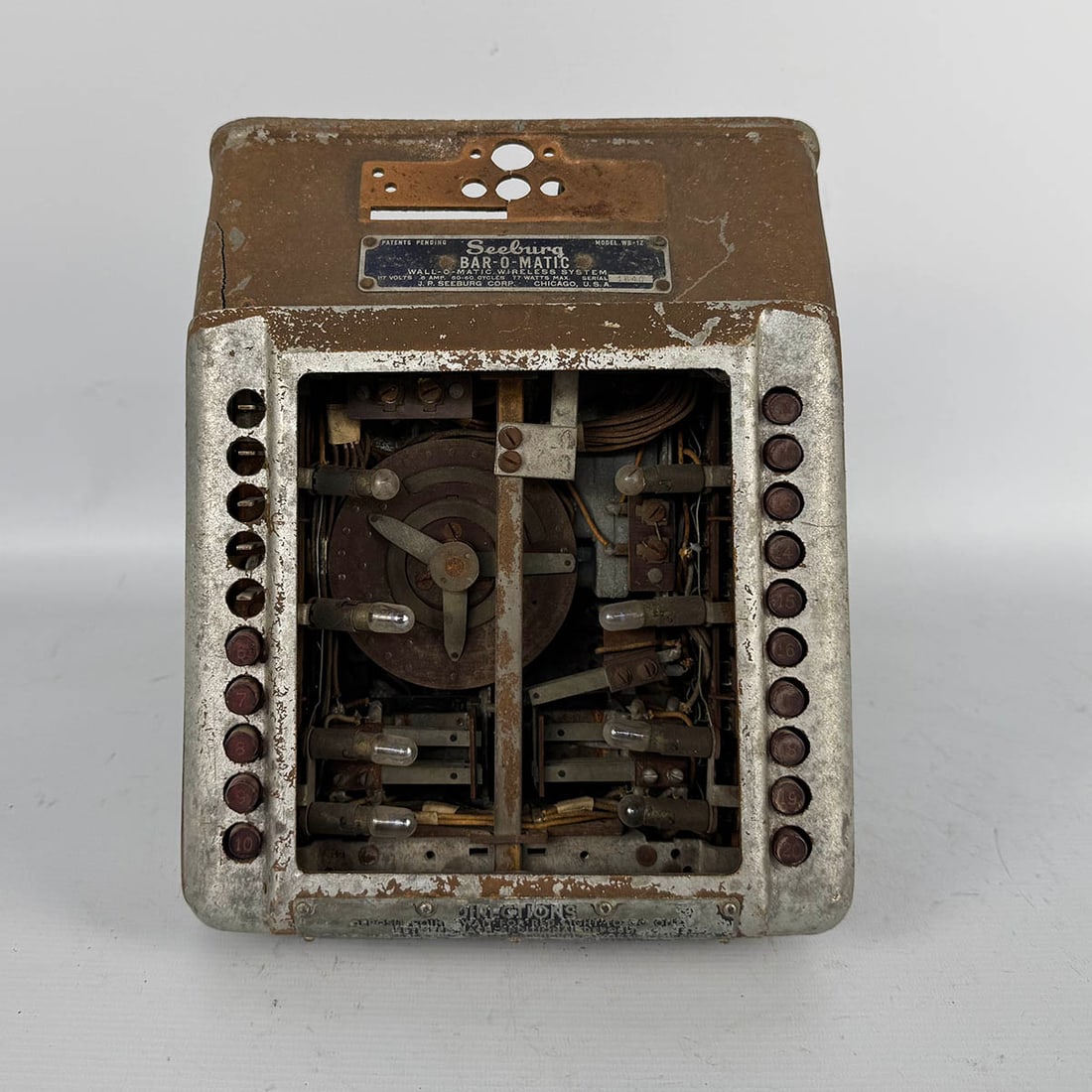 Unrestored 1940 Seeburg Bar-O-Matic WB-1Z Wireless Wallbox: Unrestored 1940 Seeburg Bar-O-Matic WB-1Z wireless wallbox. A restoration project, appears to be mostly complete, missing some buttons, title stirps and glass. Also shows overall rust and a crack in t