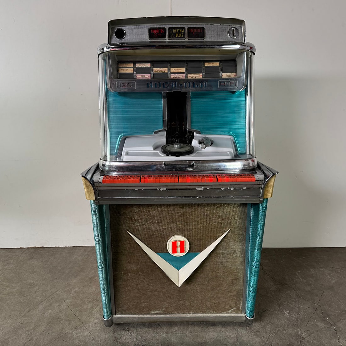 1959 Rock-Ola Model 1468 Tempo 120 Selection Jukebox: 1959 Rock-Ola Model 1468 Tempo jukebox. 120 selection jukebox playing 45 RPM records. Comes with a few records. Visual condition: good original visual condition, showing some wear. Mostly nice chrome