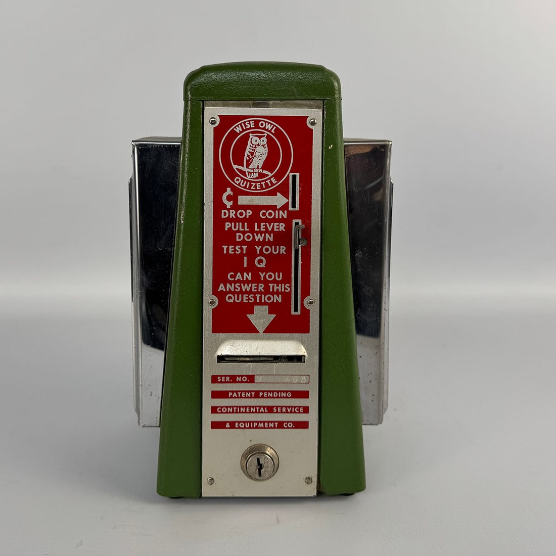 Continental Service & Equipment Co. 1 Cent "Wise Owl Quizette" with Napkin Dispensers ca. 1950: Continental Service & Equipment Co. 1 Cent "Wise Owl Quizette" with Napkin Dispensers ca. 1950. Good visual condition with a green repainted case. Comes with the key. Dimensions (H x W x D): 26 x 16 x