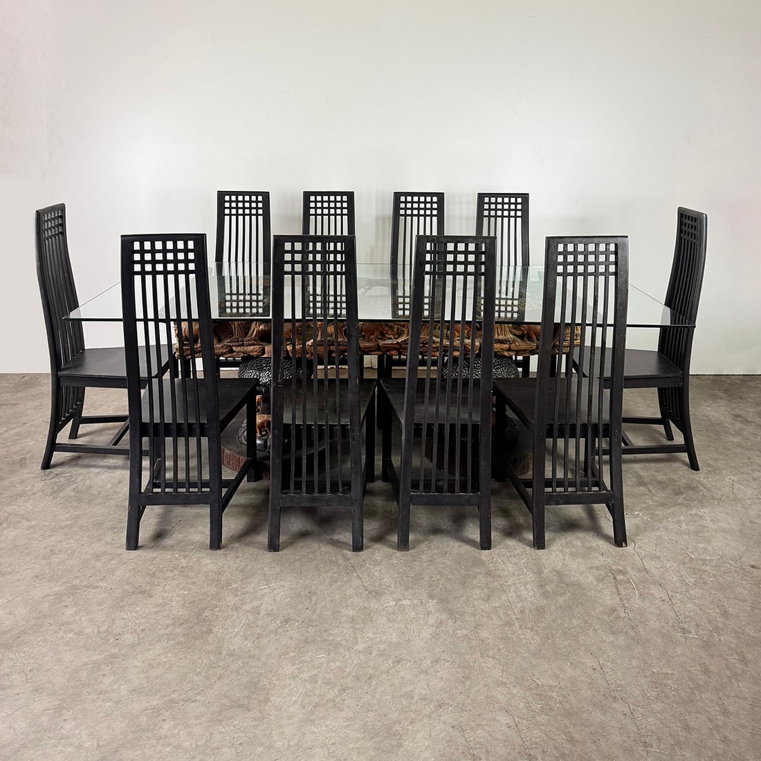 Intricately Hand-Carved Elephant Motif Dining Table with Glass Table Top and 10 Chairs: Intricately hand-carved African style elephant motif dining table with glass table top and 10 wooden chairs. Good visual condition showing wear. Condition: Good. Location: The Netherlands, Tilburg.