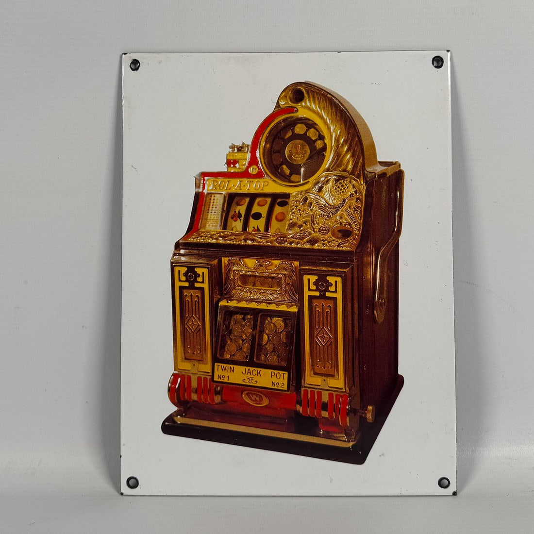 Enamel Sign with a Watling Rol-A-Top Slot Machine Print: Enamel Sign with a Watling Rol-A-Top slot machine print. Very good visual condition, showing some wear. Dimensions (H x W x D): 29 x 21 x 1 cm. Condition: Very Good. Location: The Netherlands, Tilburg
