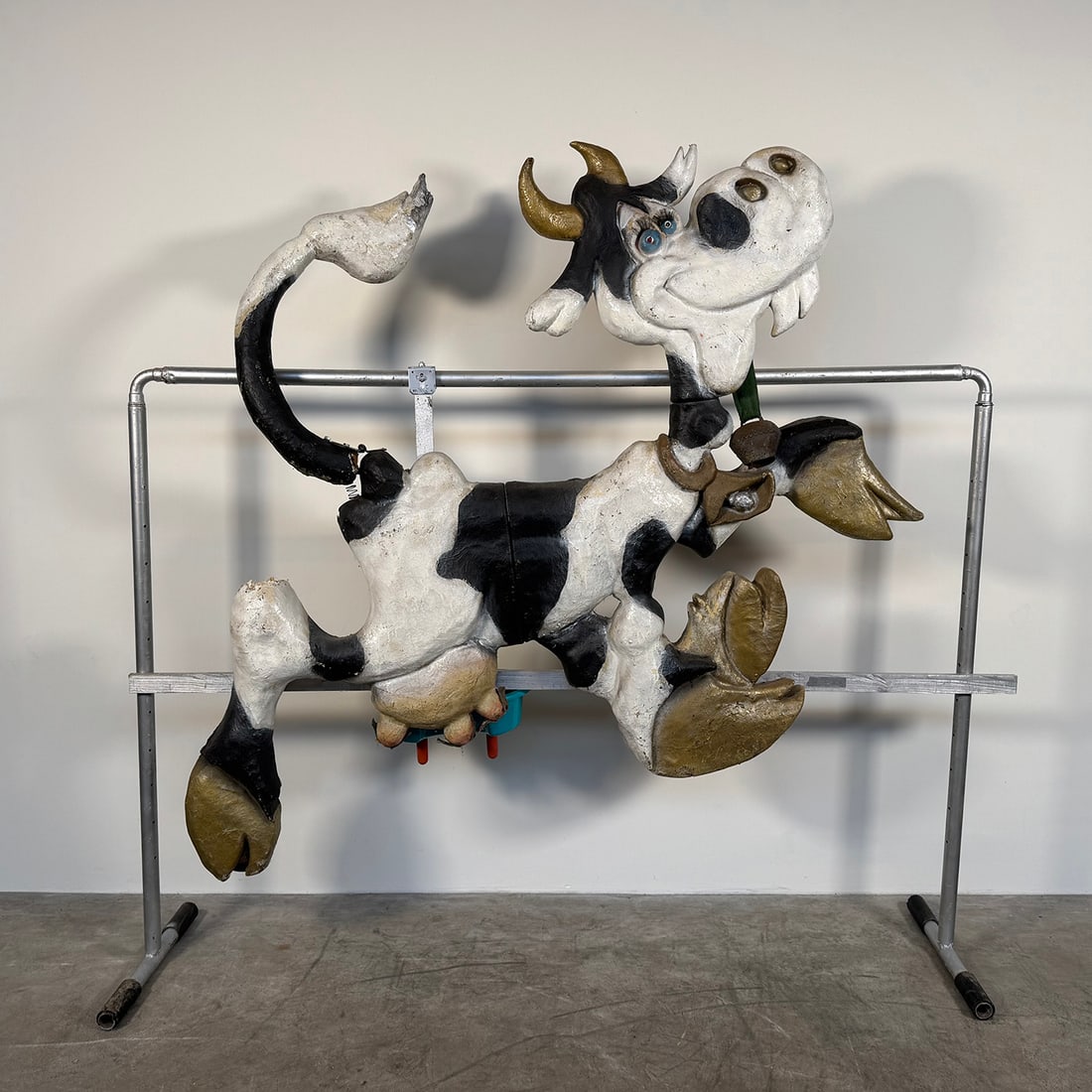 Fairground Cow Milking Game "Crazy Cow": Fairground cow milking game "Crazy Cow". The game features a fiberglass cow figure with rubber "cow's udders" attached to a refillable plastic container and mounted on a metal stand. The fiberglass fi