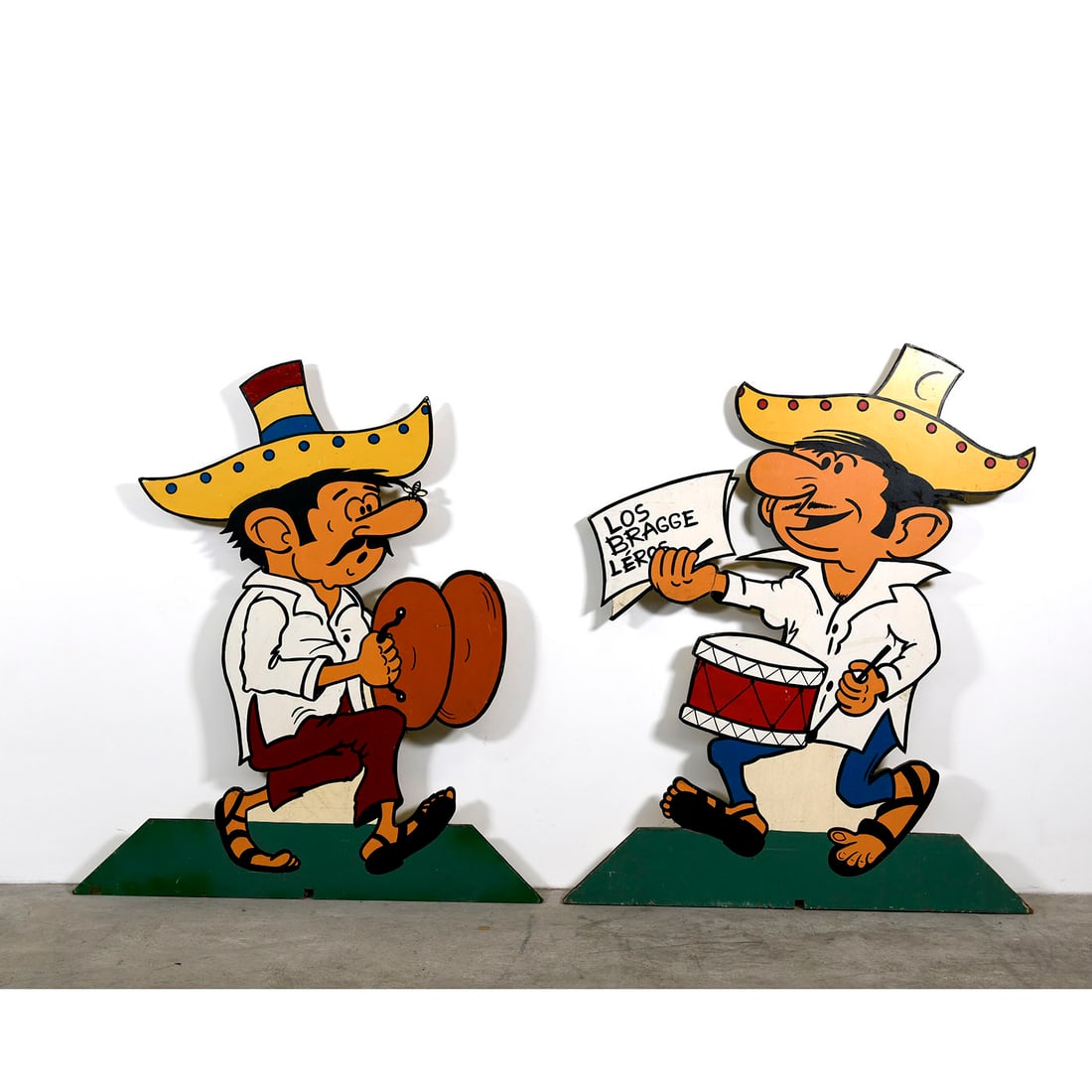 Set of 2 Vintage Wooden Panels Featuring Hand-painted Mexican Musicians: This vintage decorative set consists of two wooden panels featuring hand-painted Mexican musicians rendered in a vibrant, mid-century folk-art style. The panels show authentic signs of age with light