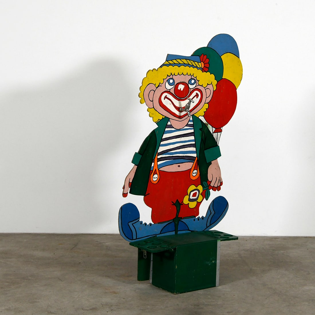 Vintage "Lemonade Clown" Countertop Beverage Dispenser: This vintage "Lemonade Clown" is a small, whimsical countertop dispenser designed with a classic mid-century carnival aesthetic. The tap is mounted on the mouth of the clown. The item shows a charming