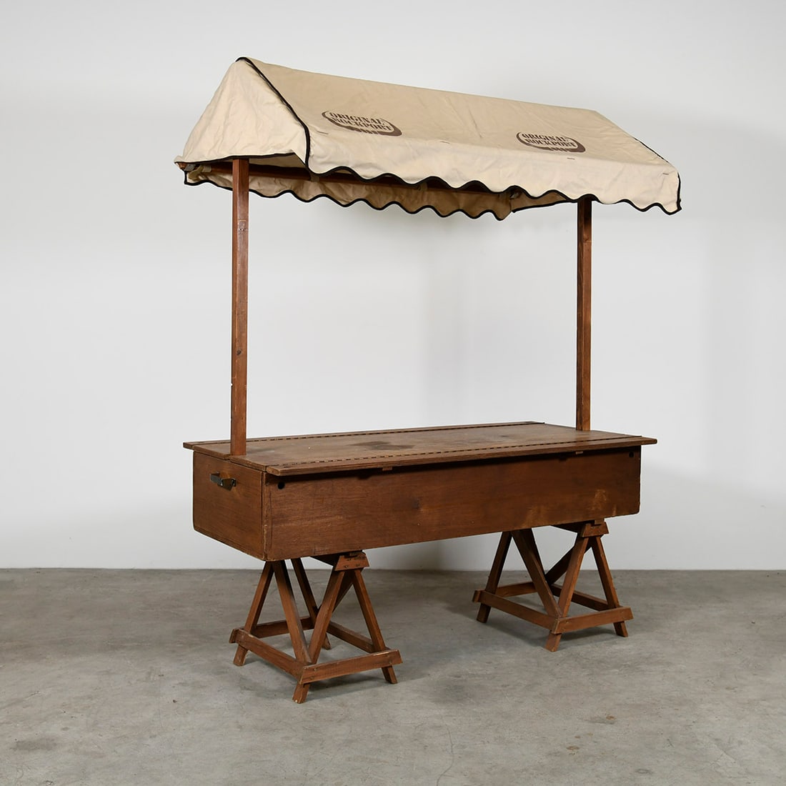 Pimlico "Original Rockport" Wooden Stall: This Pimlico "Original Rockport" wooden stall is a charming example of vintage-inspired event furniture. The stall features a sturdy timber construction with a natural, weathered wood finish, designed