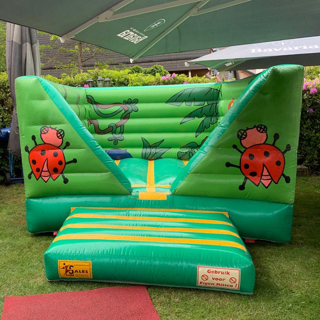 "Jungle" Theme Bouncy Castle: This "Jungle" theme Bouncy Castle is a vibrant, professionally designed inflatable attraction. Its enclosed design provides a safe, high-energy environment for children to jump and explore, while the