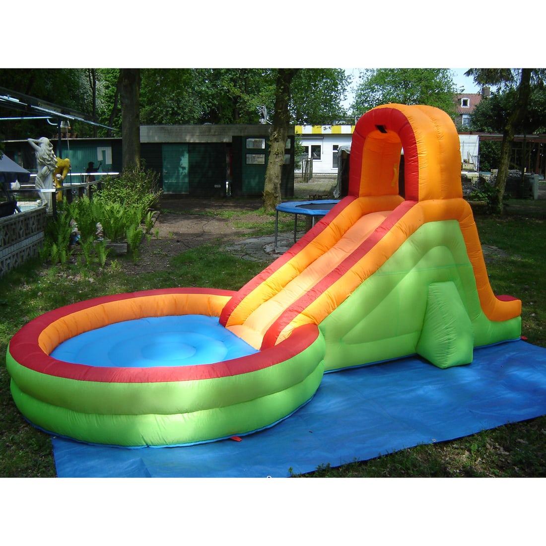 Inflatable Pool Slide Water Attraction with Included Blower: This inflatable pool slide is a water attraction featuring a sliding surface, a climbing wall and high safety rails for a secure and exciting experience. This set comes with a brand-new, unused air bl