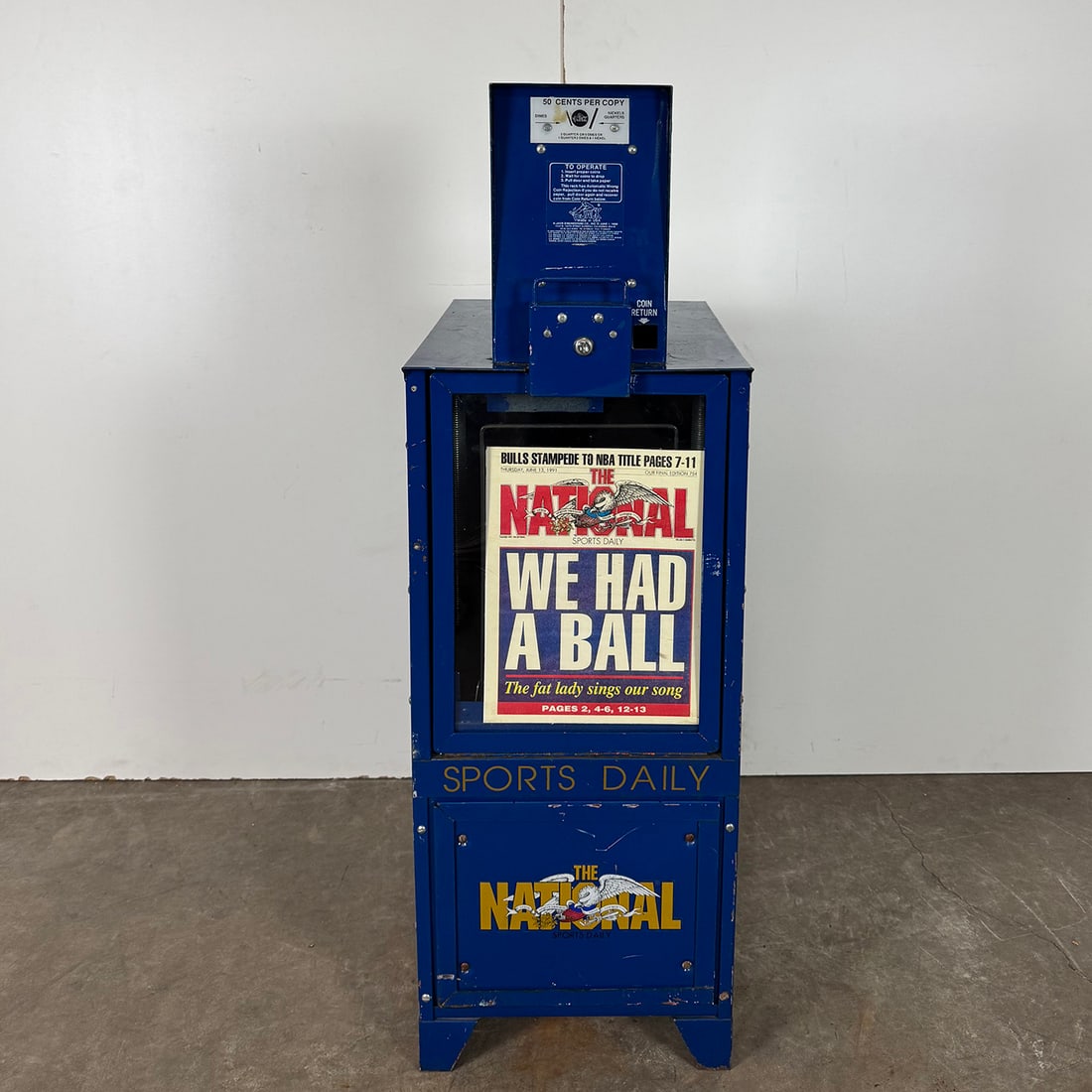 K-Jack Engineering Co. 50 Cent "The National" News Paper Vending Machine (1988): K-Jack Engineering Co. 50 cent "The National" newspaper vending machine (1988). Good visual condition, showing some wear and paint loss. Dimensions (H x W x D): 125 x 40 x 53 cm. Condition: Good. Loca