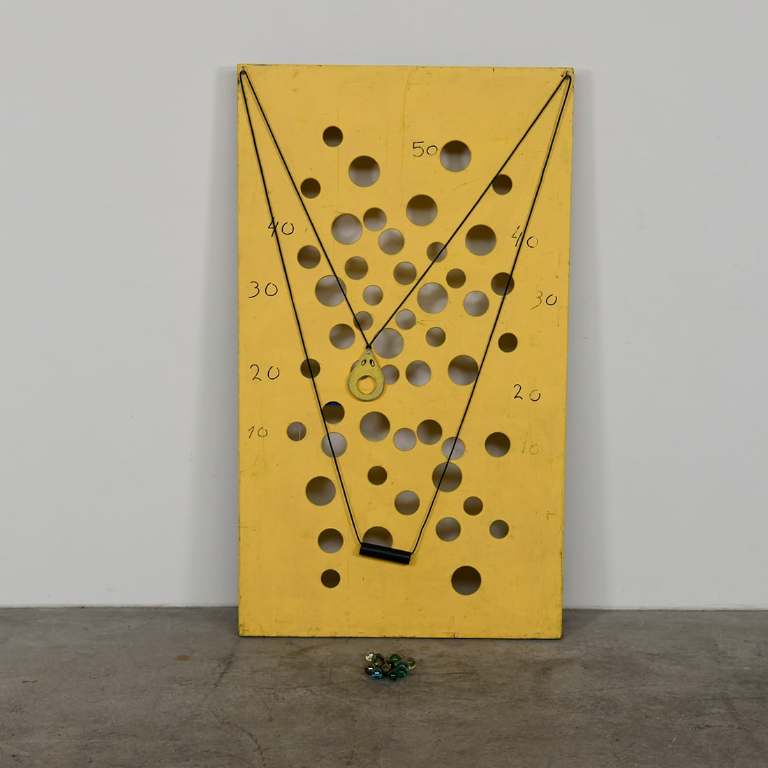 Dexterity Game with Glass Marbles in the Shape of a Wedge of Cheese.: Dexterity game with glass marbles in the shape of a wedge of cheese. Wooden base. Good visual condition. Come together with 12 marbles. Dimensions (H x W x D): 122 x 70 x 4 cm. Condition: Good. Locati