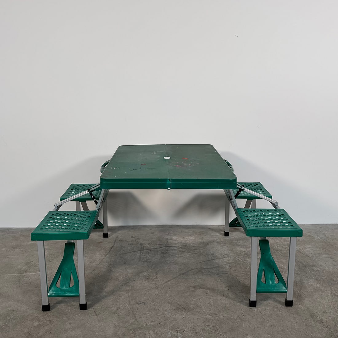 Portable Folding Children's Picnic Table with Built-in Seats: Portable folding children's picnic table with built-in seats. Dimensions in fully folded position: 47 x 85 x 10 cm. In good visual condition showing wear and paint marks. Dimensions (H x W x D): 70 x