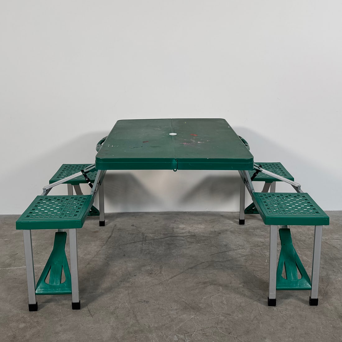 Portable Folding Children's Picnic Table with Built-in Seats: Portable folding children's picnic table with built-in seats. Dimensions in fully folded position: 47 x 85 x 10 cm. In good visual condition showing wear and paint marks. Dimensions (H x W x D): 70 x