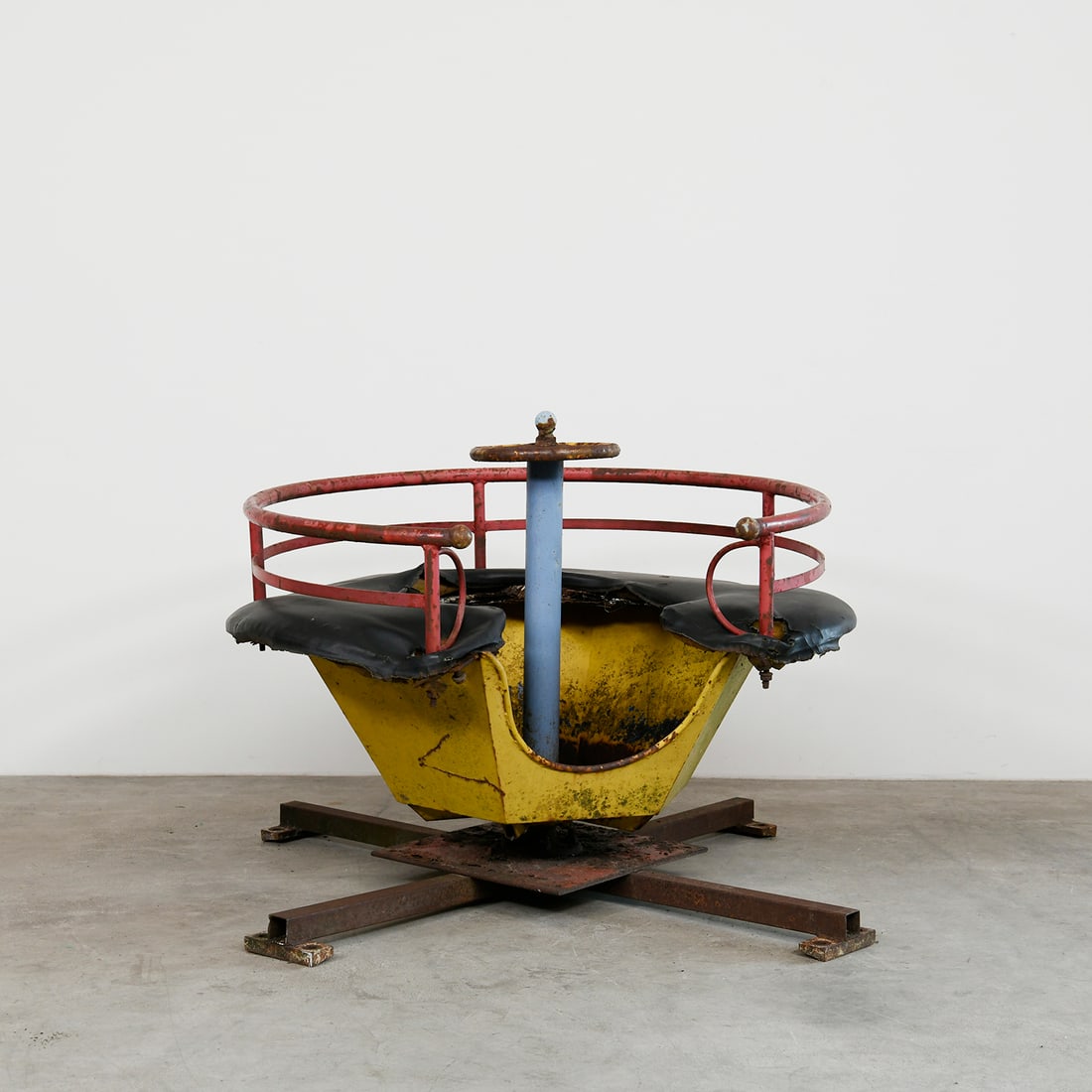 Vintage Children's Carousel UFO Ride: Vintage children's carousel UFO ride. Constructed from metal with soft padded seats, the ride can be mounted on a carousel or used on its own. It can seat multiple children and the central "steering w