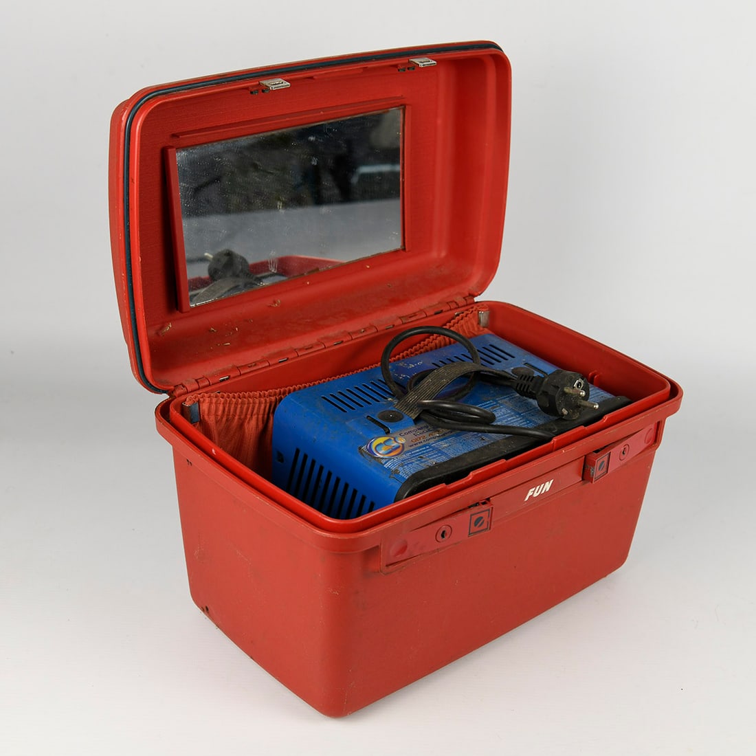 1 red case with a 12-volt battery charger for charging the bumper cars: Electric battery charger used for charging children’s ride-on vehicles from a scooter or traffic playground track. The charger is designed to recharge the batteries of electric ride-on scooters and