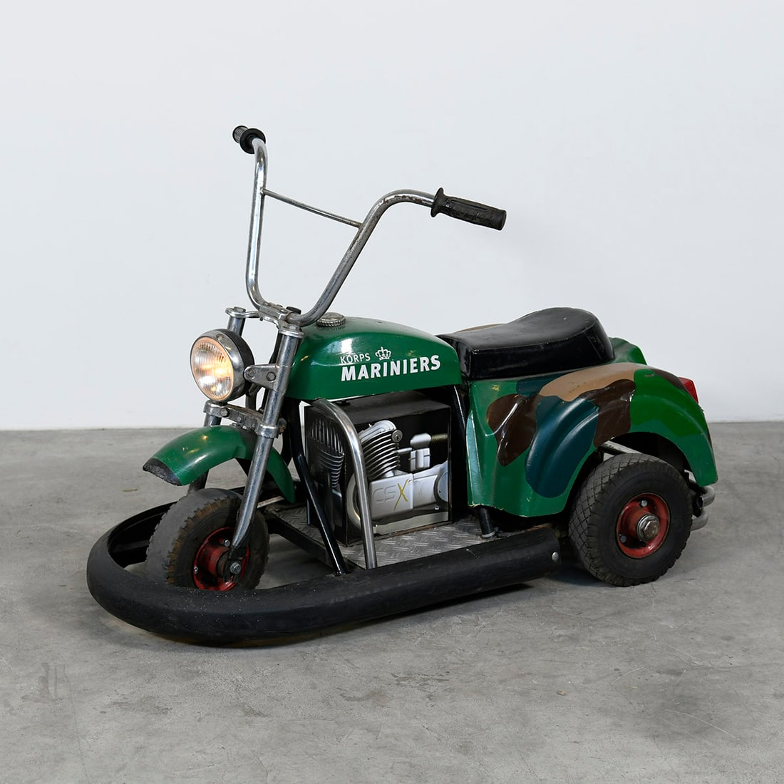 "Korps Mariniers" 12-Volt Electric Children's Bike: The Electric Children's "Korps Mariniers" vehicle is a modeled after The Royal Netherlands Marine Corps. Operates on a 12-volt battery system and includes functional lights. The bike is in a good work