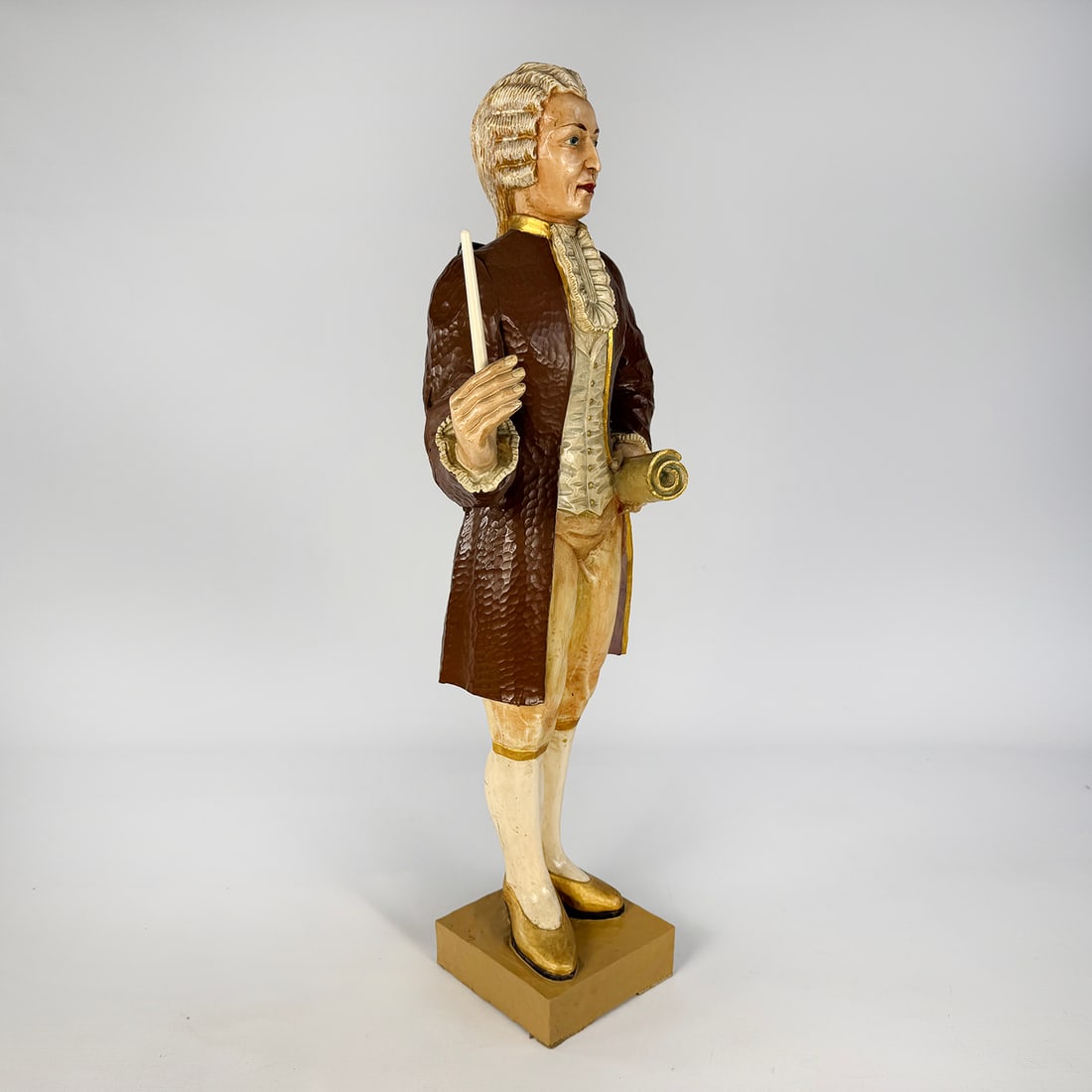 Heinrich Voight Organ Figure with Mechanical Arm Movement: This Heinrich Voigt organ figure, produced by the esteemed Frankfurt-Höchst workshop, is a meticulously hand-carved linden wood sculpture featuring a synchronized mechanical arm movement designed to