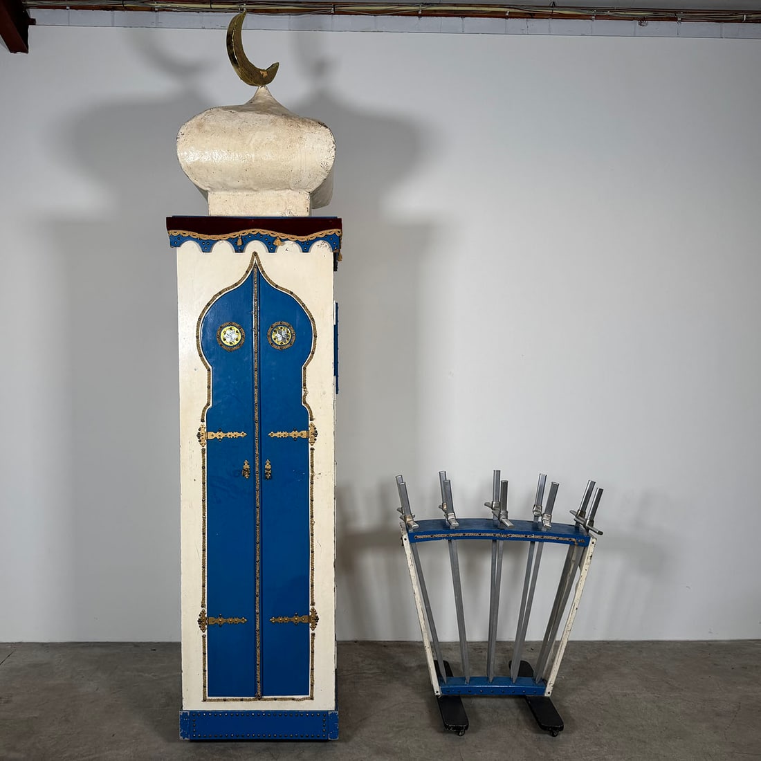 "Eastern Tower with Moon" More Than 70 Years Old Sword Penetration Stage Illusion: "Eastern Tower with Moon" more than 70 years old sword penetration stage illusion. This is a classic stage illusion where an assistant enters inside the illusion through the doors, and the magician us