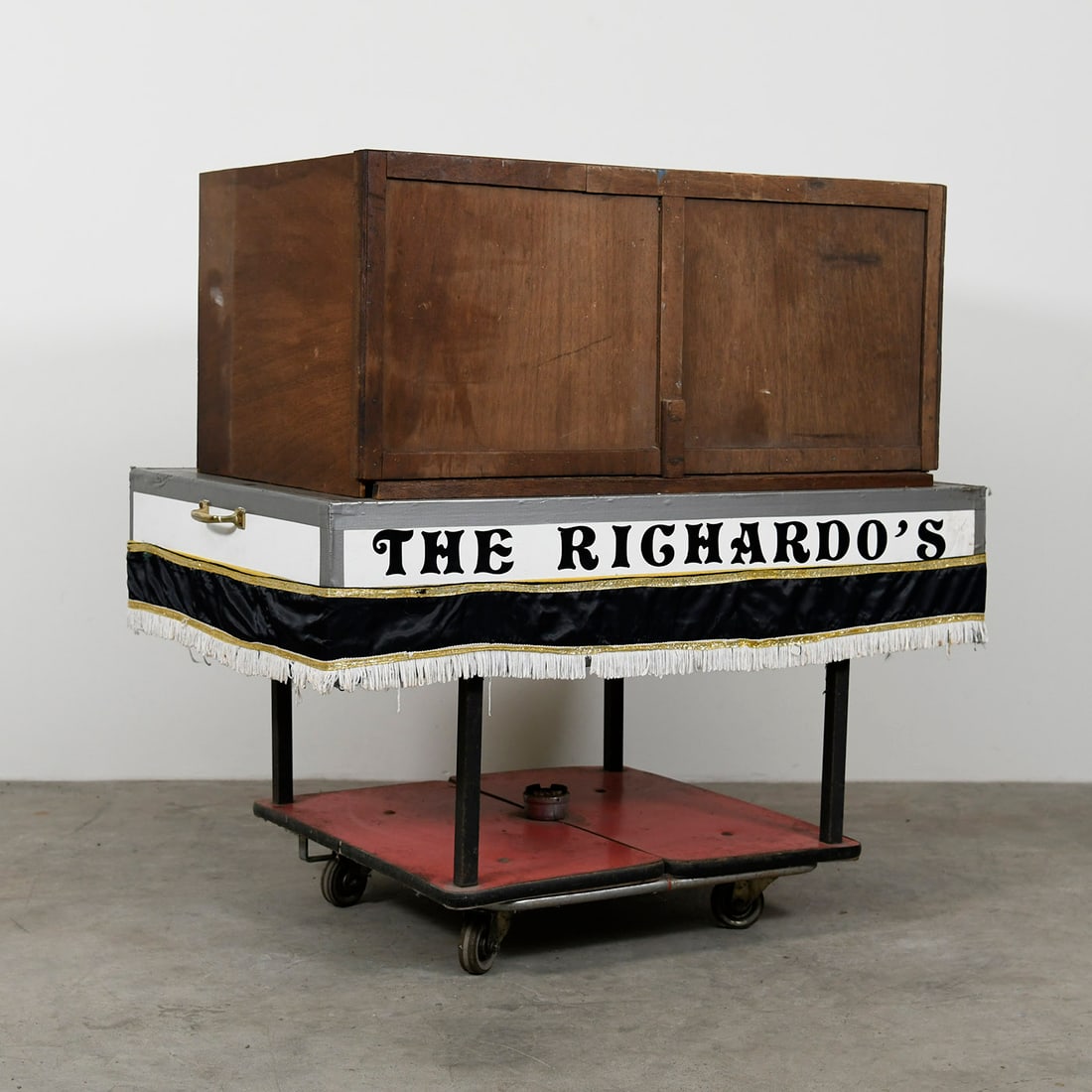 The Richardo's Production Box a Unique 50 Years Old Illusion Built by Richard Dreijer: The Richardo's Production Box is a unique 50 years old illusion built by Richard Dreijer. The illusion is presented folded flat. The magician raises the wooden panels of the illusion making a box. Var