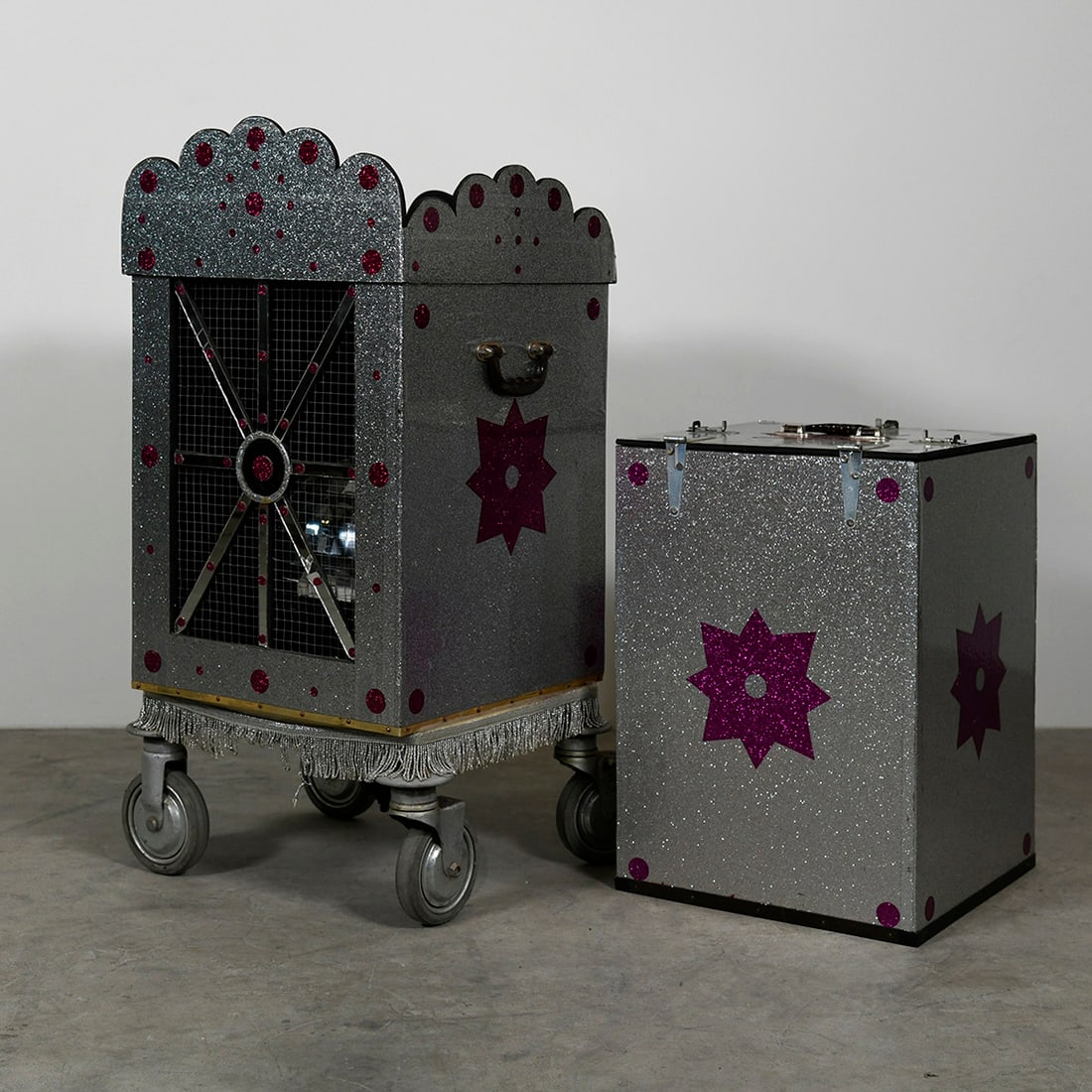 Floating Mirror Ball Production Cabinet Illusion: Floating mirror ball production cabinet illusion. The magician removes a box from a cabinet showing that it is empty, then a small mirror ball is placed inside the cabinet. The box is once again place