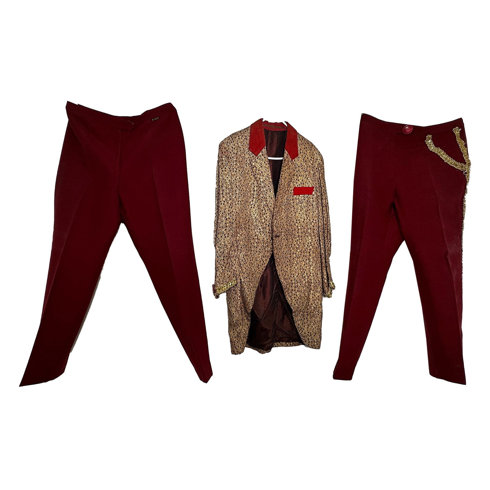 Richardo's Gold-red Clown Costume with Two Red Trousers (1960): Richardo's gold-red clown costume with two red trousers (1960). This was the first clown costume Richardo ever owned. Fair visual condition showing wear and aging. Condition: Fair. Location: The Nethe