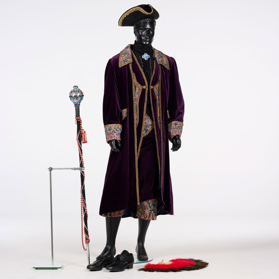 One of the 2 Original Costumes Used by Royce to Perform the "De Koker" Illusion: One of the two original costumes used by Royce to perform the "De Koker" illusion. Gemini This ornate 18th-century style costume features a long, deep purple velvet coat paired with matching knee-leng