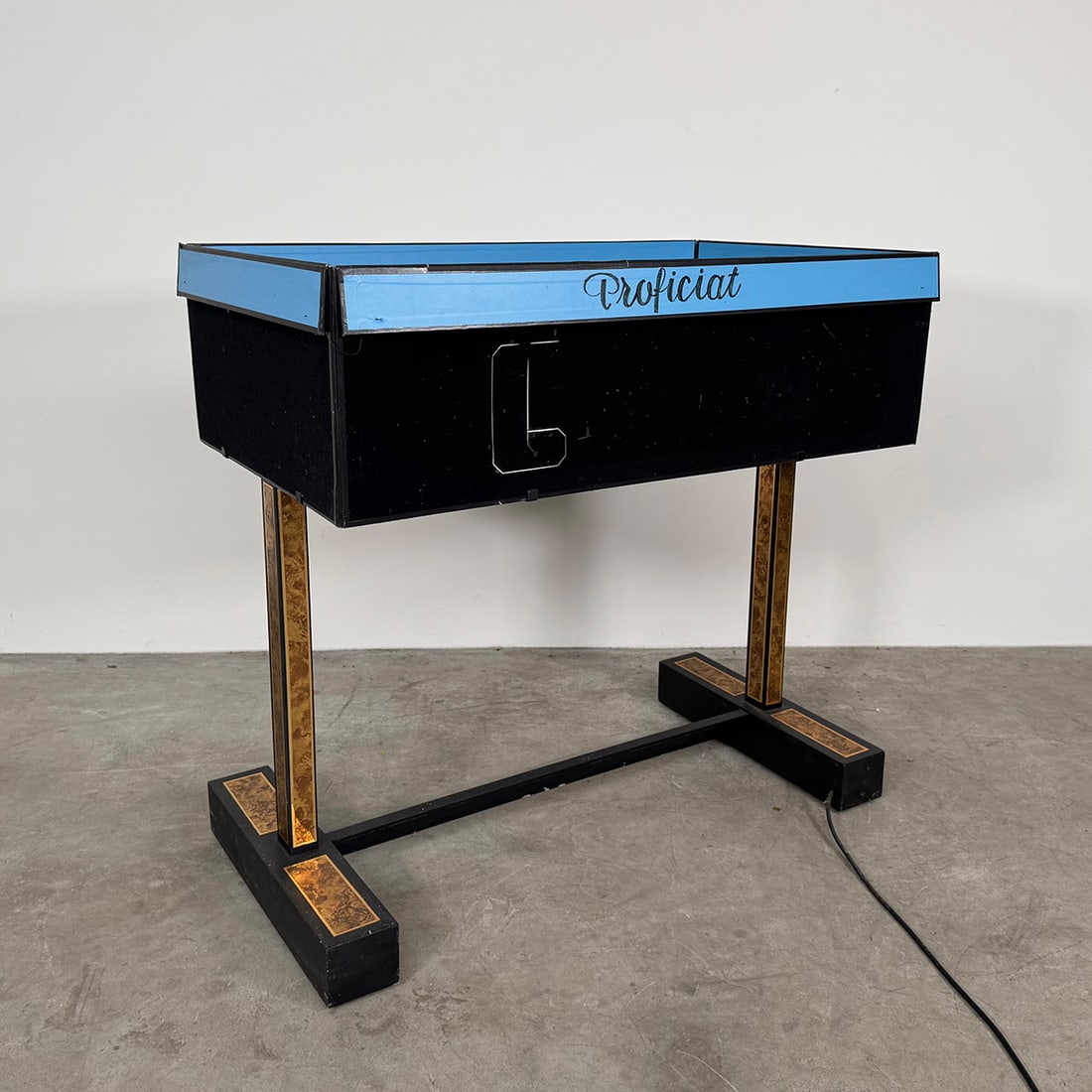 "Presentation Table" Production Illusion: A flat empty table is shown to audience on which the magician places raised sides. Shortly flat or unfolding objects are produced from the box. Royce made a model of a new building appear. Operated by