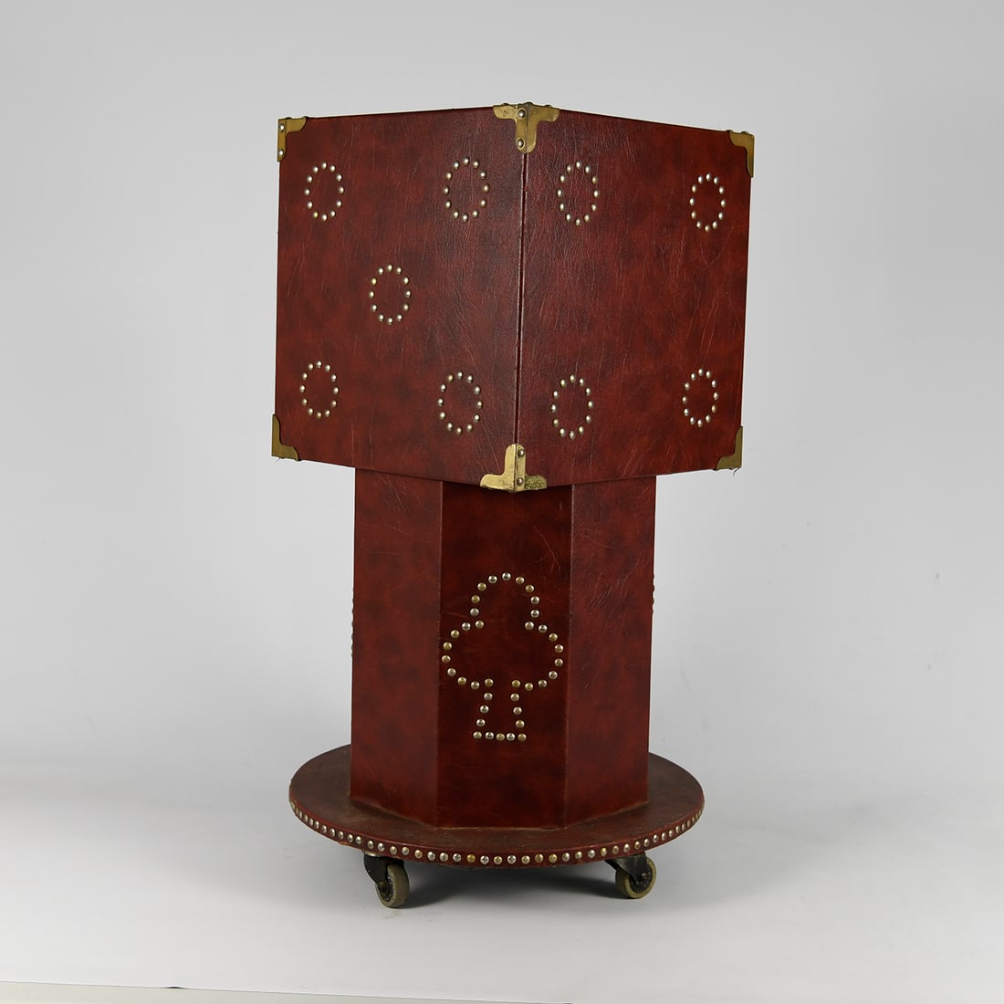 Vintage Red Leather Covered Magic Table used by Royce in 1970s: This vintage red leather and stud covered magic table was the first used by Royce in 1970s. He took it with him as a street magician and he often appeared in newspaper articles with it. Good visual co