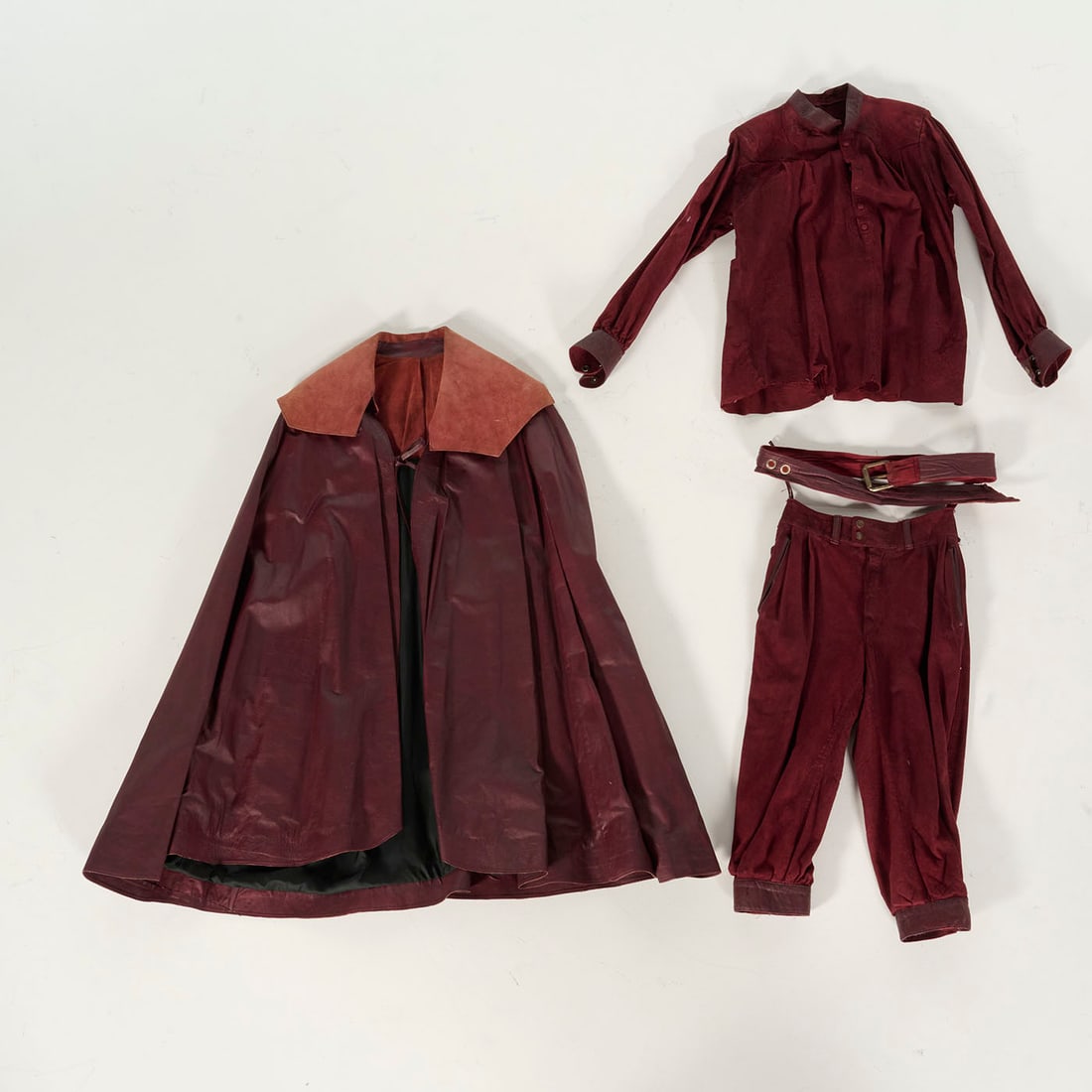 Original Red Leather Costume with a Cape Used by Royce in 1970s: Original red leather costume with a cape used by Royce in 1970s. Royce's early costumes are smaller, this particular one fits a narrow 40 size. Please use our provided images to judge the condition. L