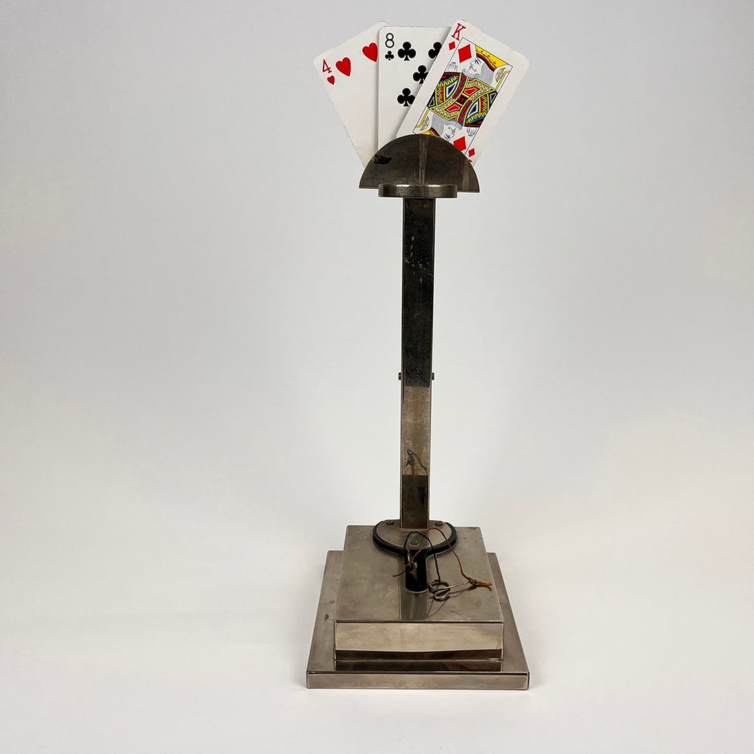 Balloon to Cards Magic Trick: Balloon to Cards Magic Trick. A blown up balloon bursts and reveals selected cards. The 3 cards are on a spring mechanism which displays the cards like a small fan. Maker unknown. Dimensions (H x W x