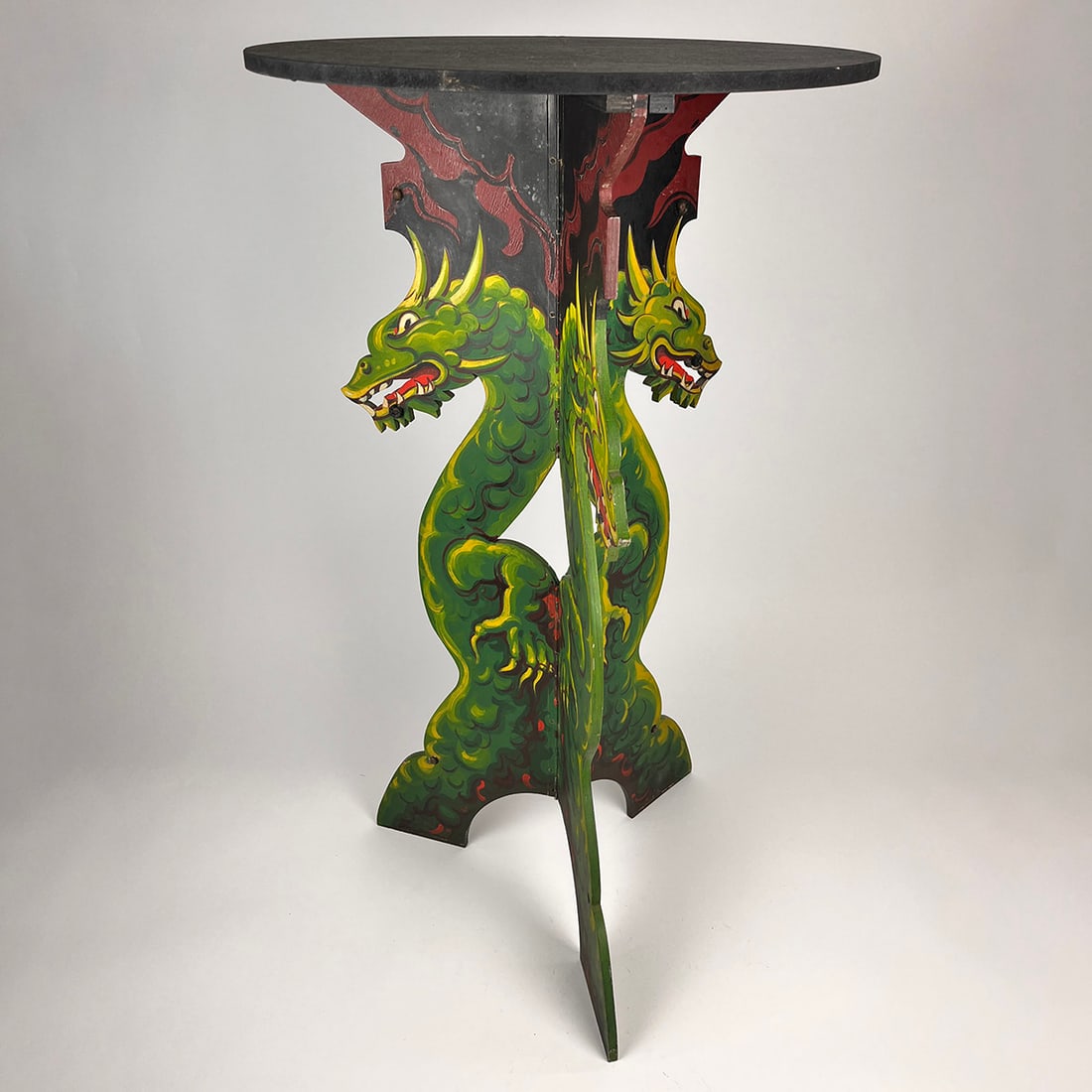Magic Dragon Table owned by the world famous Okito Theo Bamberg: Magic Dragon Table said to have been owned by the world famous Okito Theo Bamberg. Tripod table with dragon artwork on one side and black on the other. The table folds flat, and the round top surface