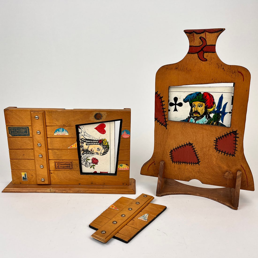 Metamorphosis Magic Trick by Wolfgang Grosskopf: Metamorphosis stage version magic trick by Wolfgang Grosskopf. Two giant playing cards (Jack and Queen) change places in the Houdini way :-) In very good condition. Dimensions (H x W x D): 33,5 x 24 x