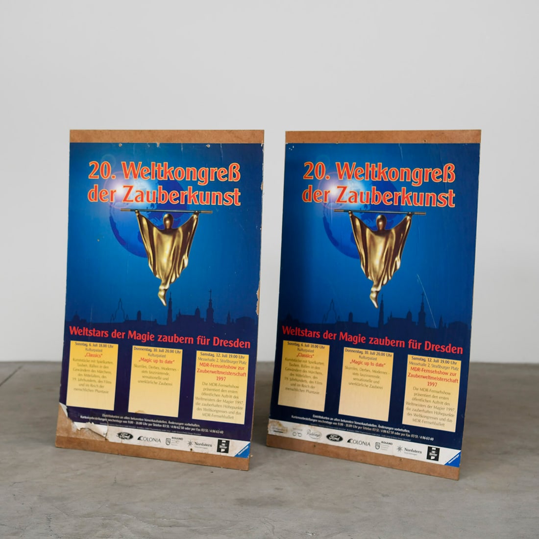 Set of 2 German 1997 FISM Dresden Posters - "20. World Congress of Magic": Set of 2 German 1997 FISM Dresden posters - "20. World Congress of Magic". The posters are glued on hardboard. Overall fair condition, showing damage. Dimensions shown for a single poster. Dimensions