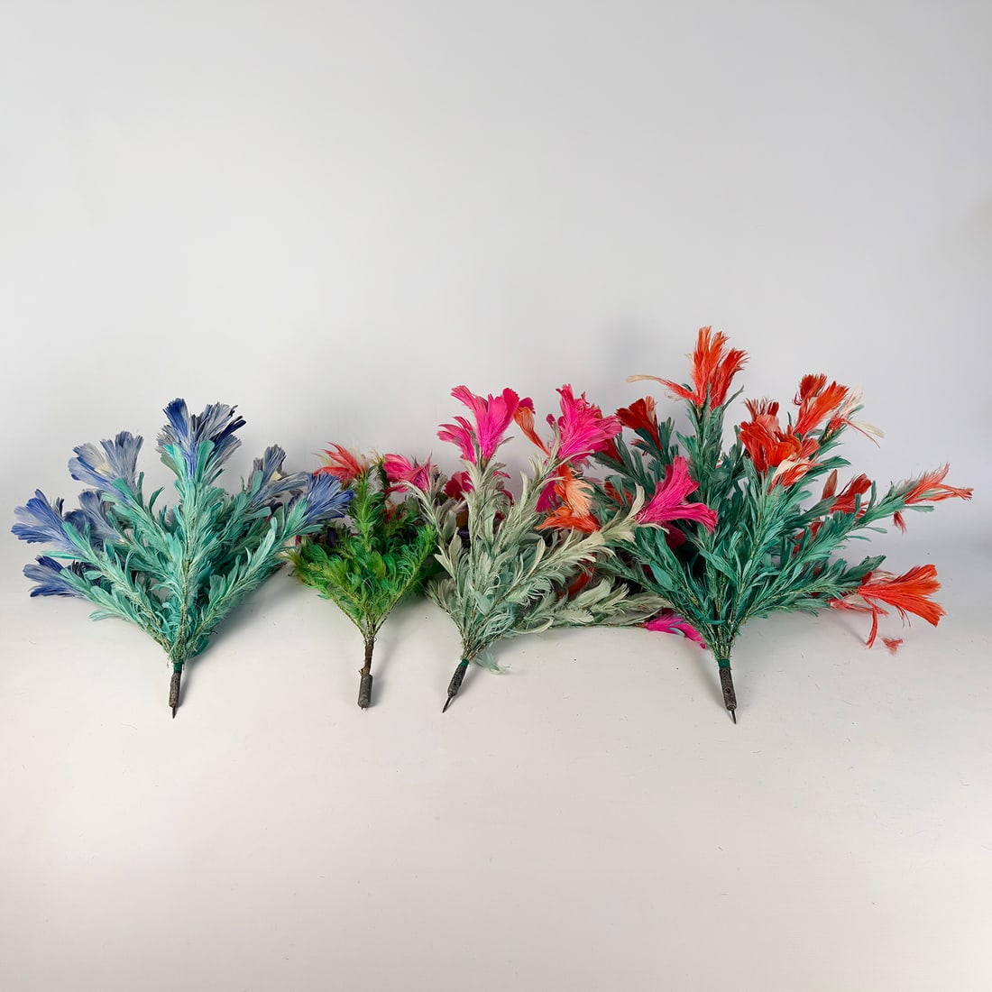 Lot of 4 Magic Props - Unfolding Flowers with Darts: Lot of 4 magic props - unfolding flowers with darts. The weighted darts allow magician to throw the flowers making them stick in wooden material. The flowers come stored in PVC pipes. Dimensions shown