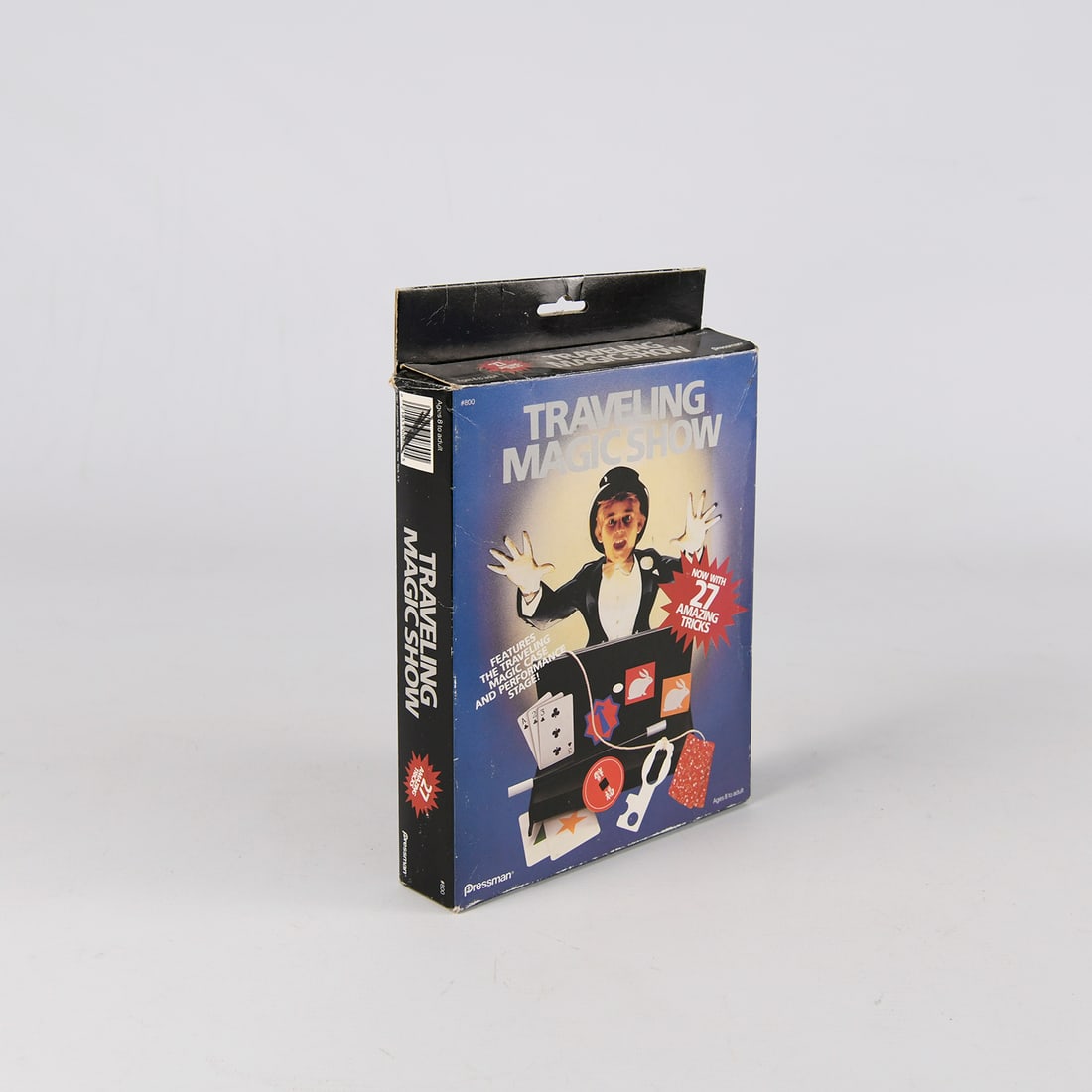Traveling Magic Show: Compact magic set including a performance stage and various magic props. Comes with instructions for 27 amazing tricks, perfect for beginners. Condition: Box shows visible wear from storage. Contents