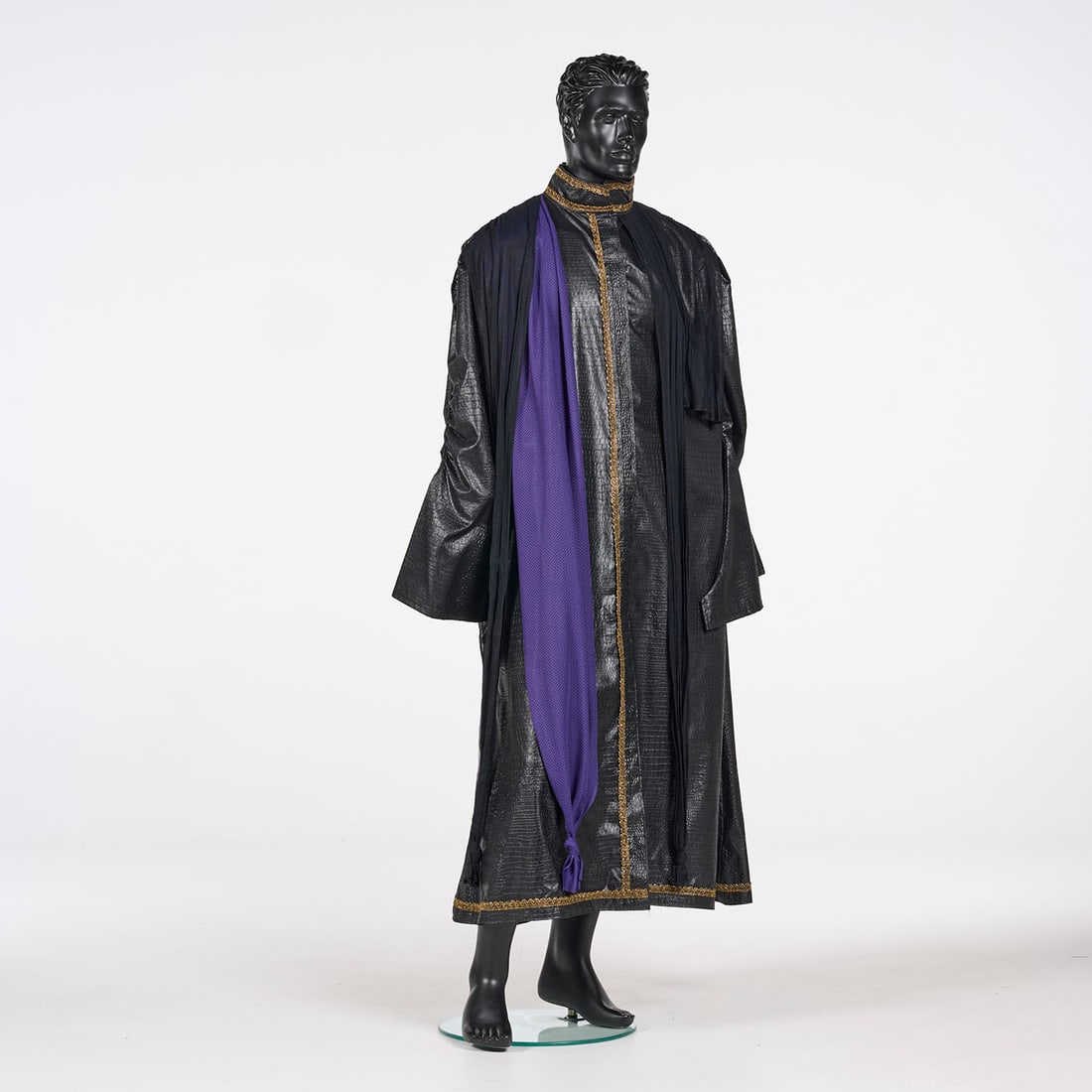 Original Black Costume with a Cape Stage Used by Royce's Assistants: Original black costume with a cape stage used by Royce's assistants. This floor-length black costume features a high, stand-up collar and a robe constructed from a textured fabric resembling crocodile