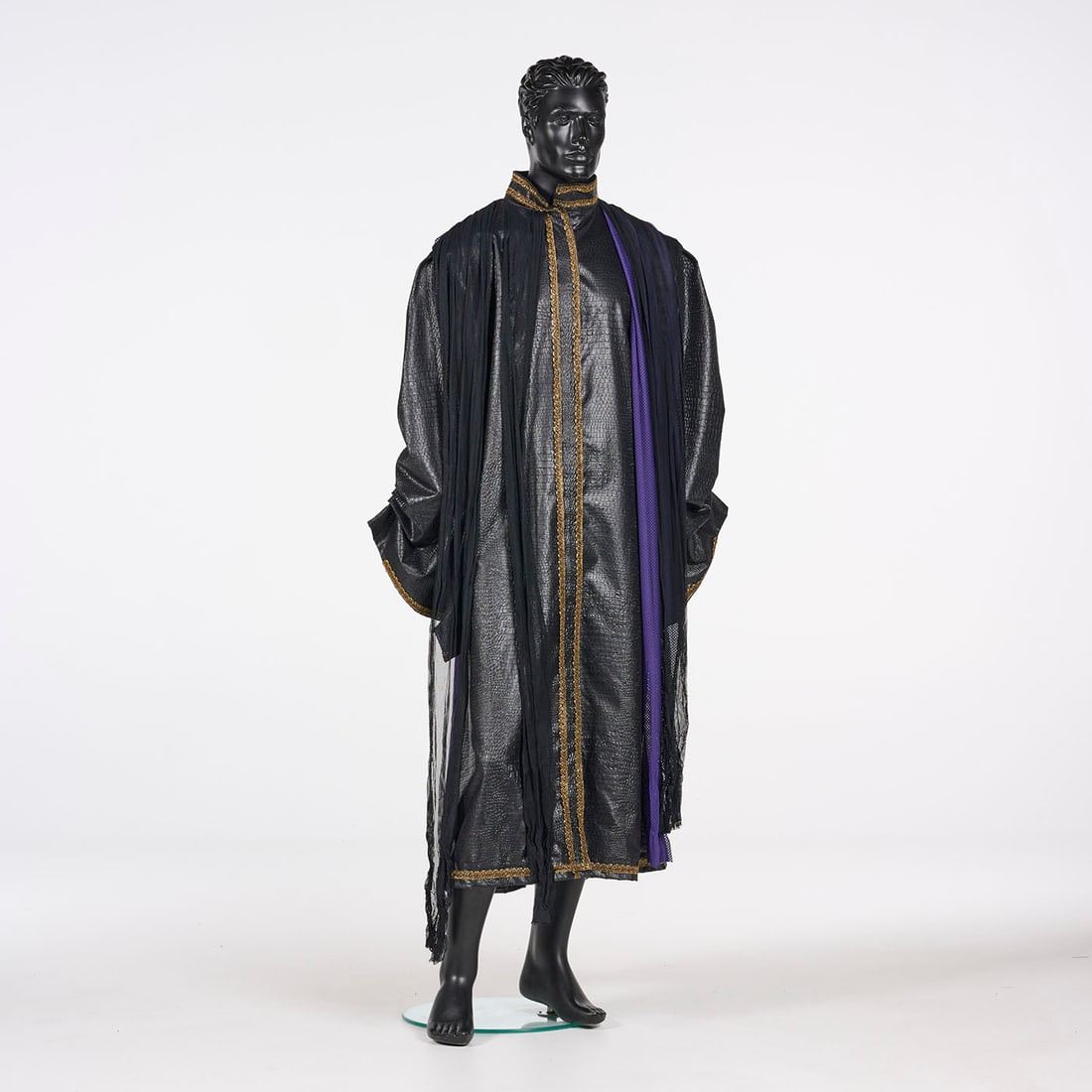 Original Black Costume with a Cape Stage Used by Royce's Assistants: Original black costume with a cape stage used by Royce's assistants. This floor-length black costume features a high, stand-up collar and a robe constructed from a textured fabric resembling crocodile