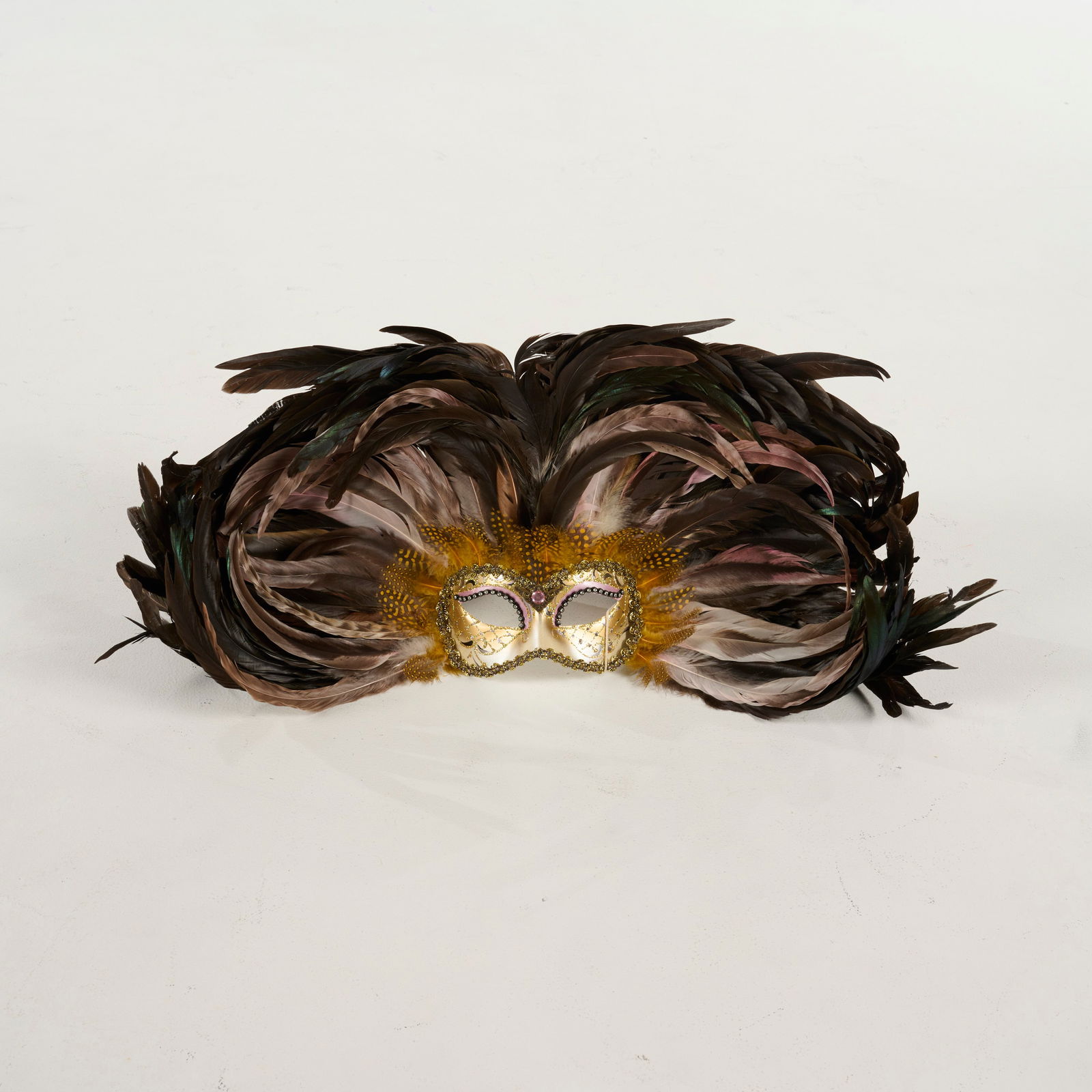 Original Hand-painted Venetian Masquerade Half-Mask from the Royce Collection: Original hand-painted Venetian masquerade half-mask featuring a dramatic fan of natural and iridescent dark green feathers, from the Royce Collection. Please use our provided images to judge the condi