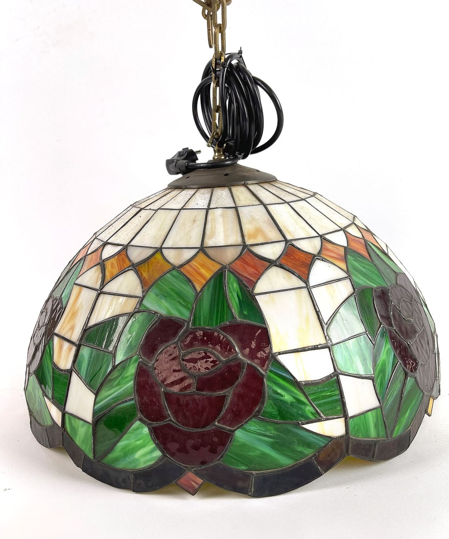 Tiffany Style Hanging Ceiling Lamp with Rose Motif: Tiffany style stained glass hanging ceiling lamp with rose motif. The lamp has one bulb fixture and has an European power plug. Dimensions (H x W x D): 50 x 50 x 34 cm. Condition: Very Good. Location: