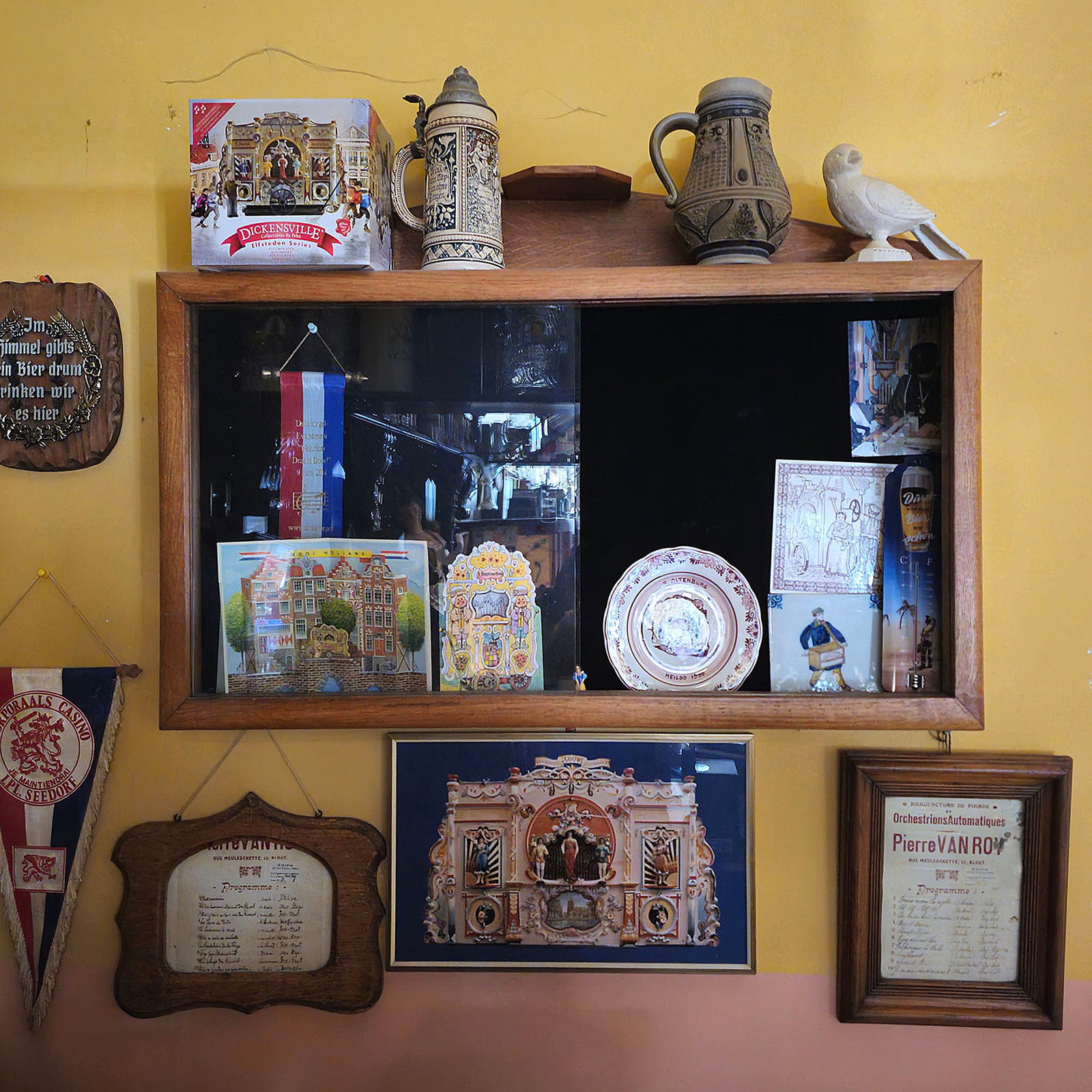 Wooden Wall Cabinet with Various Organ Collectibles from the G. Perlee Collection: Wooden wall cabinet with sliding glass opening containing various organ collectibles from the G. Perlee collection. The cabinet originally comes from a Dutch school. Dimensions (H x W x D): 59 x 87 x 