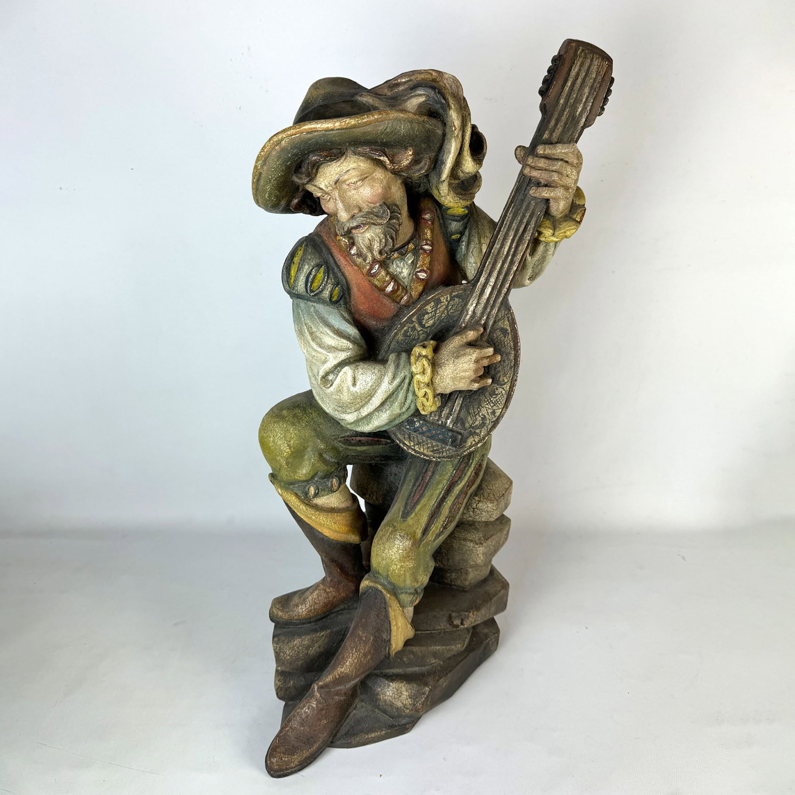 Contemporary Patrick Demetz Carved Wooden Mandolin Player Figure: A beautiful contemporary wooden mandolin player figure carved by Patrick Demetz in Val Gardene, Italy. The Demetz family is one of the best woodcarving families in the world. Artificially aged look, m