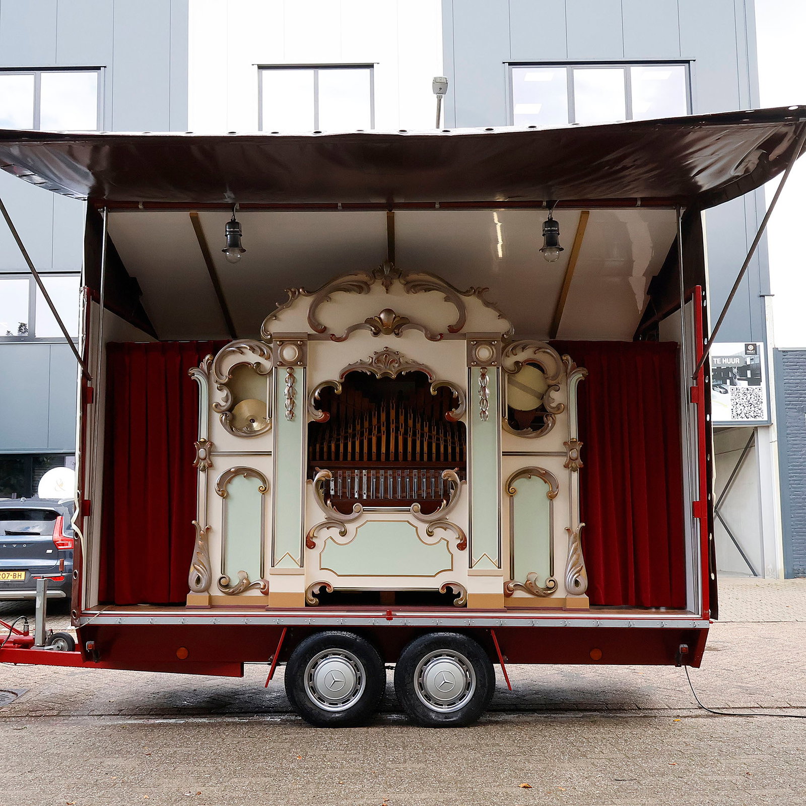 Rare 59-key Frans Decap Fairground Organ (1940s): This rare 59-key fairground organ was constructed in the 1940s by Frans Decap, a member of the renowned Gebroeders Decap organ-building family of Antwerp. Housed in an ornate carved facade finished in