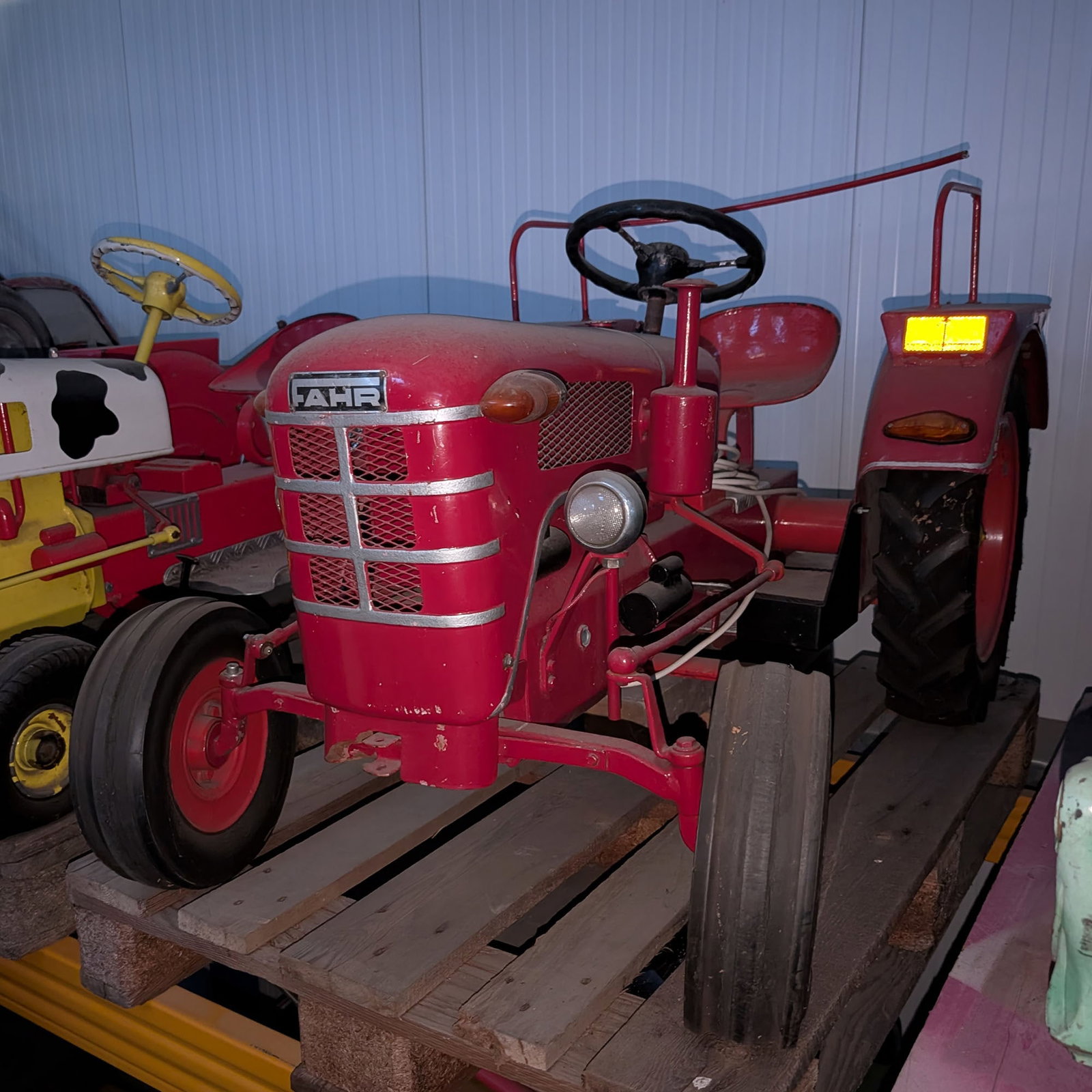 Hennecke "Fahr" Carousel Tractor - Vintage German Fairground Ride Vehicle: Original Hennecke carousel tractor, styled after a classic Fahr agricultural tractor and made for use on a children's carousel or fairground ride. This attractive example features a red body with FAHR