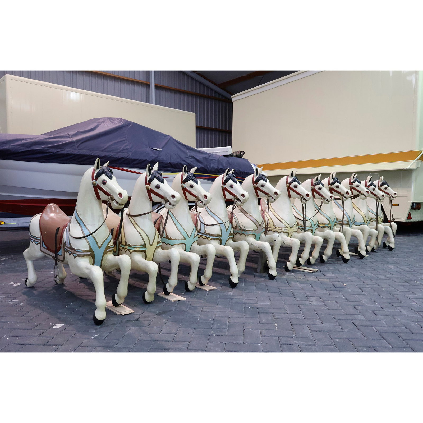 Set of 11 Solid Wooden Carousel Horses from "De Carousel", Vlissingen, Netherlands: Attractive matching set of 11 solid wooden carousel horses, formerly used at the entertainment and casino venue "De Carousel" in Vlissingen, The Netherlands. The horses are carved from solid wood and 