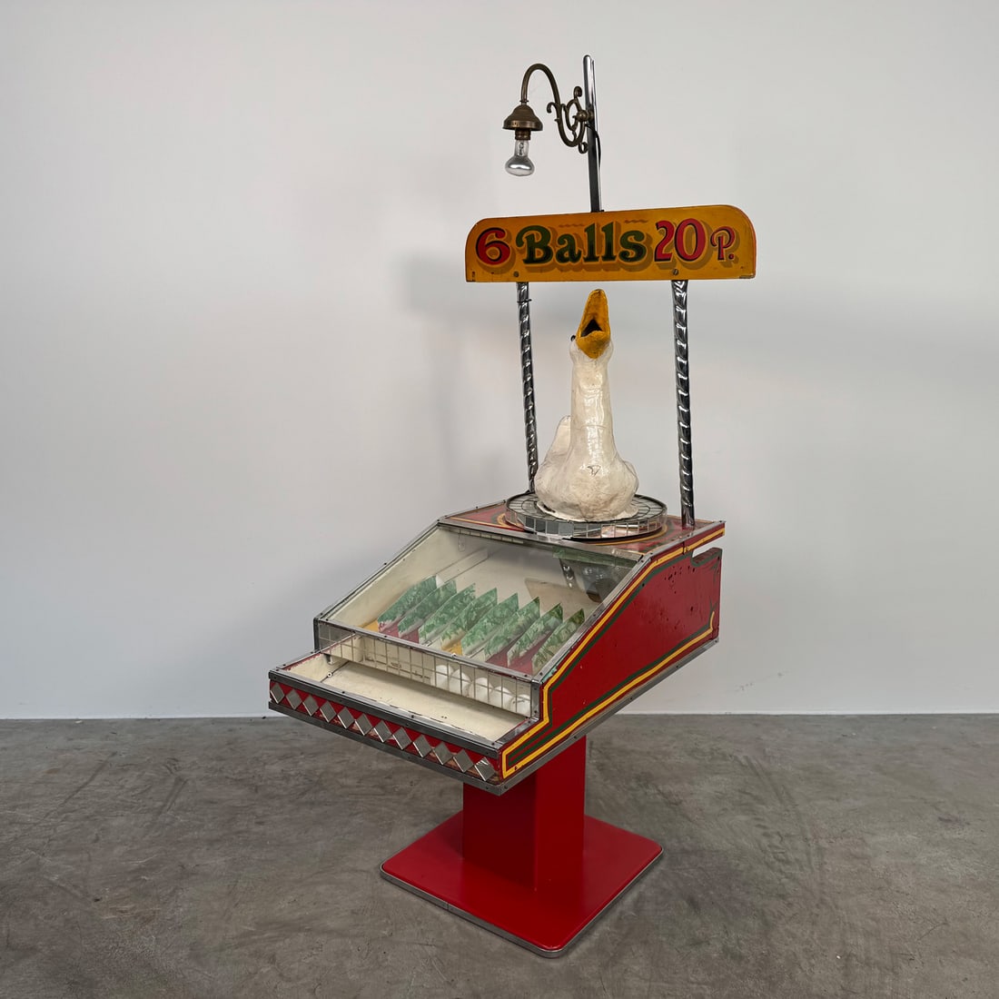 Rare British 1940s-1950s Goose Roll-A-Ball Game: Rare British roll-a-ball game from the 1940s-1950s featuring a papier-mache goose. Players aim to achieve the highest score by placing six balls into the goose's mouth, where the balls then roll down 