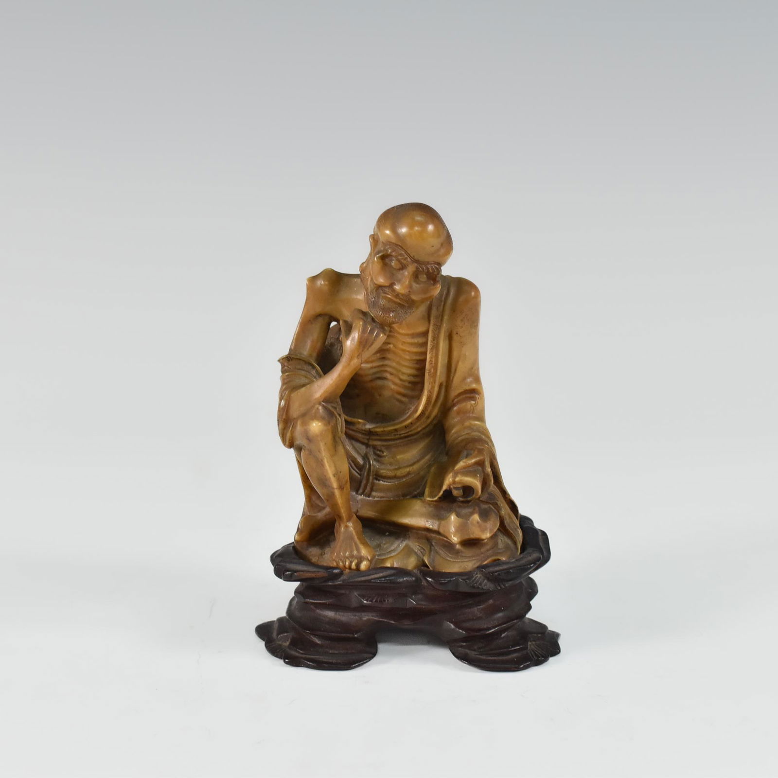 A CHINESE CARVED SOAPSTONE FIGURE OF LUOHAN (1 of 9)
