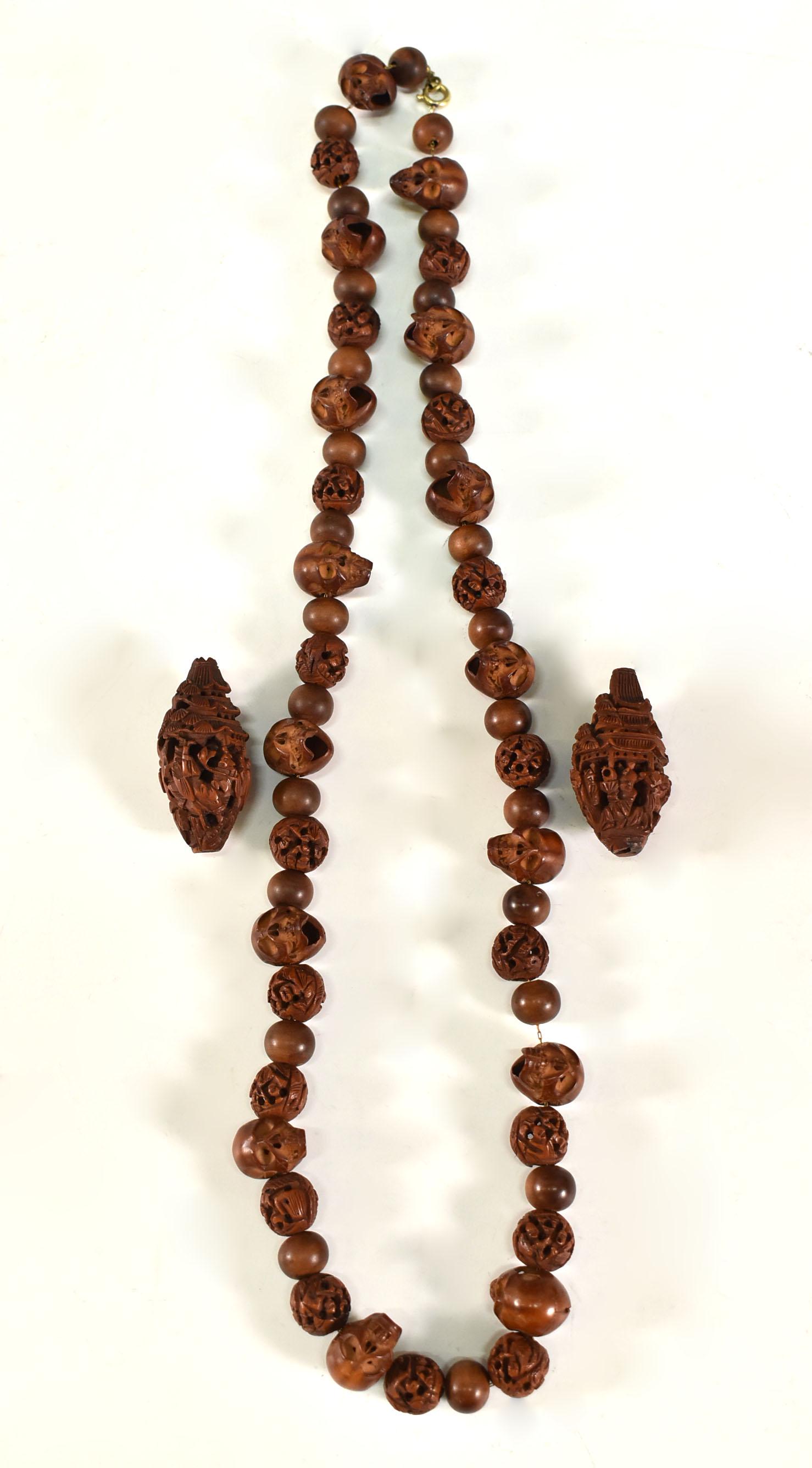CHINESE ANTIQUE TANXIANG NECKLACE AND OLIVE PIT CARVINGS: Chinese Antique Tanxiang Necklace And Olive Pit Carvings. NECKLACE: L 24" PIT: 1 1/8"