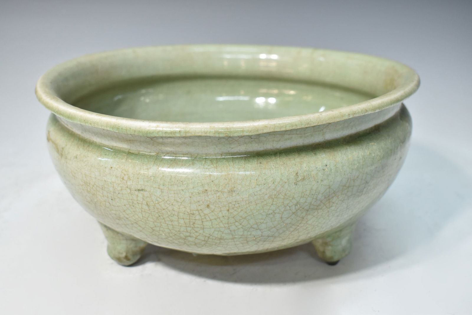 CHINESE LONGQUAN CELADON TRIPOD BURNER (CRACKED IN BOTTOM): Dimensions: D 11 1/2" CHINESE LONGQUAN CELADON TRIPOD BURNER (CRACKED IN BOTTOM)