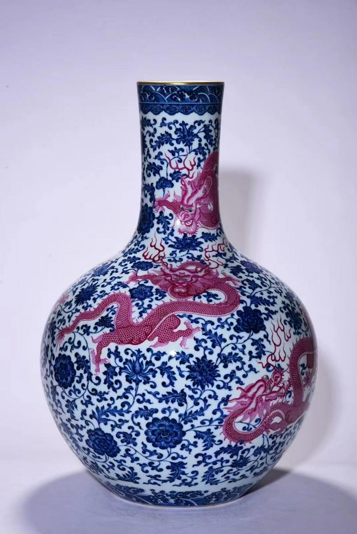 Qing Dynasty blue and white carmine dragon pattern celestial bottle (1 of 8)